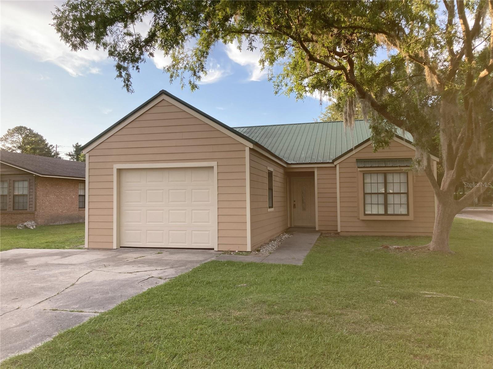 This 3 bedroom, 2 bath home is Move-In-Ready Featuring all new appliances, Hvac, water heater, paint, and much more. 1,322 square feet of living space, nestled in Grandview Village, a prime location near schools, shopping and outdoor activities, this home offers the perfect blend of comfort, convenience, and Florida charm. Enjoy the freedom to personalize your space without any HOA restrictions. Don't forget about the Fireplace & Metal Roof!