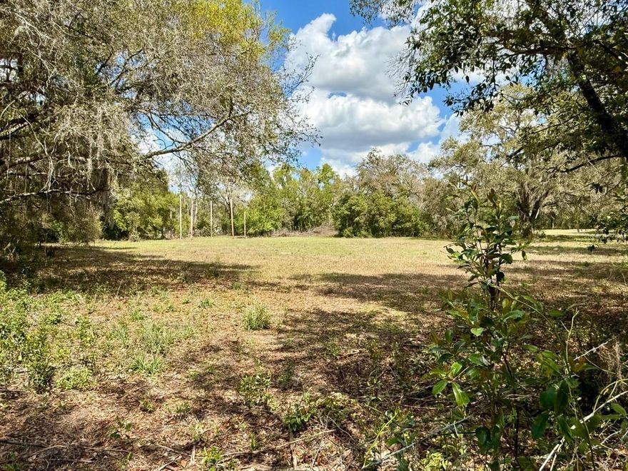 PRICED BELOW APPRAISED VALUE!! Build your dream home on 8 PICTURESQUE ACRES in a highly desirable area of Dade City. This property is ready for someone with vision to restore its magic and preserve a piece of history. The current, inhabitable home is situated at the front near the main road and could be utilized as storage or removed altogether leaving you with a clean slate for a new build with IMPACT FEES PAID, WELL, SEPTIC, & ELECTRIC AVAILABLE! Property offers multiple cleared, high elevation homesites with stunning views of rolling green pastures. Conveniently located just 10 miles from I-75 and only minutes from Dade City, where you can enjoy charming shops, local dining, and year-round festivals. This is a rare opportunity to own a true historic gem with acreage and incredible potential.