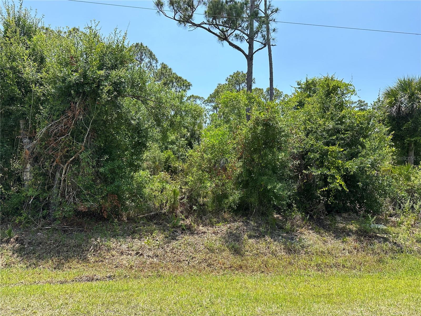 Experience the tranquility of this serene waterfront property in the heart of Tropical Gulf Acres, poised to become the canvas for your dream home. Positioned in one of the desired spots in the community, this parcel sits at the rear, bordered by a spacious pond, ensuring utmost seclusion. A mere stone's throw from the vibrant offerings of Punta Gorda, prospective residents will revel in the myriad of activities, from leisurely boating and fishing adventures to indulging in exquisite dining experiences and perusing charming boutiques. Accessibility is effortless with convenient proximity to Interstate 75 and a mere 10-minute drive to Punta Gorda Airport, facilitating seamless travel to and from various destinations.