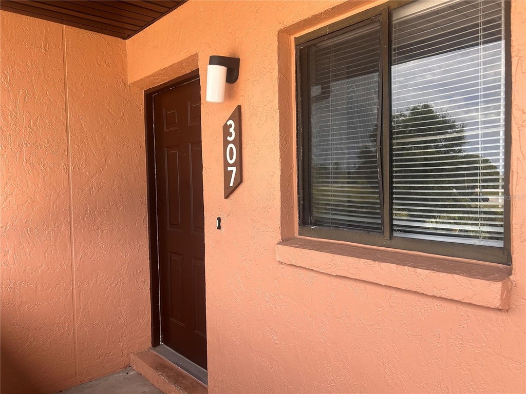 Photo of 1712 University Ln #307, Cocoa, FL 32922 (MLS # O6424754)