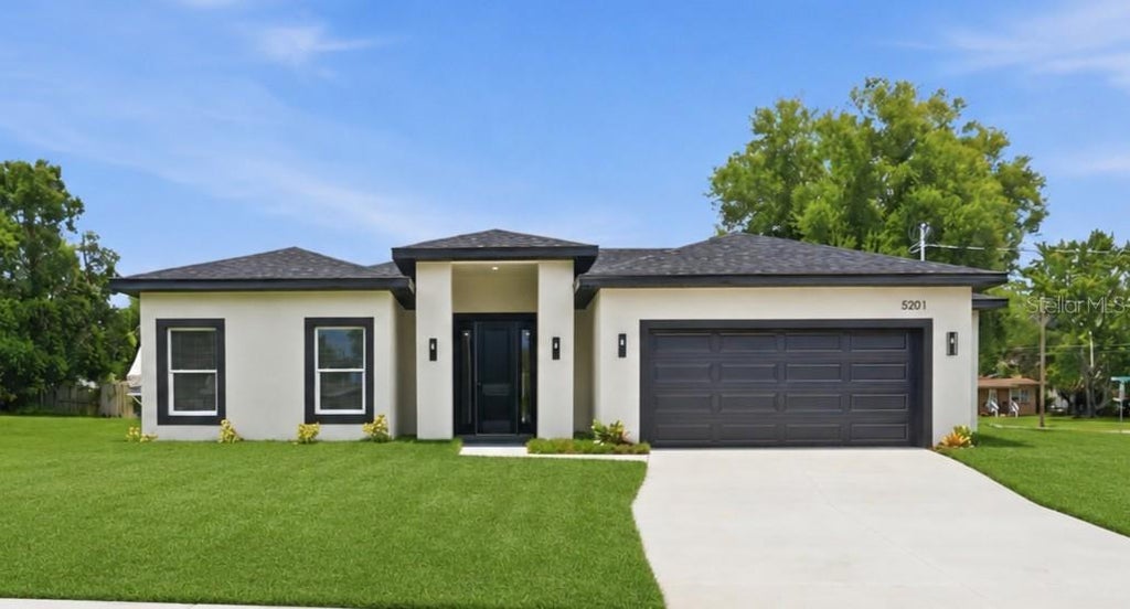Photo of 5201 Ashwood Place, Orlando, FL 32808 (MLS # O6418981)
