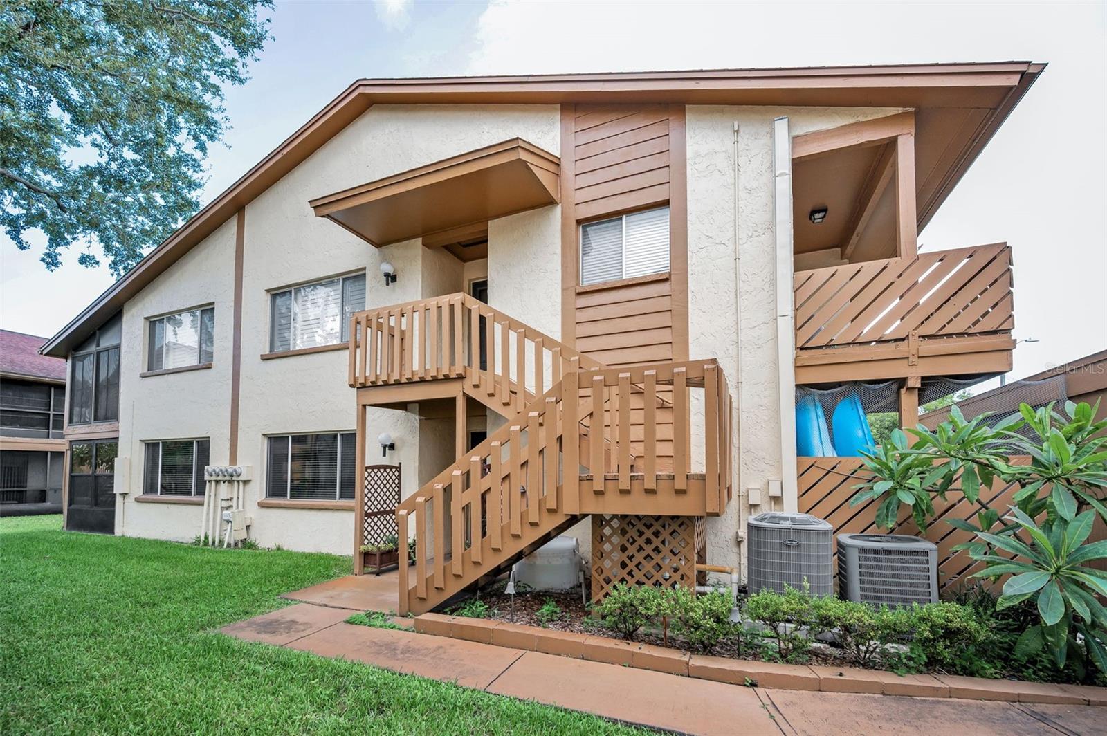 STUNNING MOVE IN READY - 55+ MAINTENANCE FREE ~ TROPICAL SETTING ~ EXCELLENT LOCATION ~ GROUND FLOOR CONDO ~ FLORIDA LIVING AT IT'S FINEST for either your seasonal getaway or full time residence, you do not want to miss this private, light bright, well maintained split floor plan condo featuring 2 bedrooms, 2 baths, 1144 square feet with a covered carport. Just inside the front door is an open airy gathering room with sliding glass doors to the inviting back outdoor lanai. The STUNNING REMODELED kitchen features newer cabinets with brushed nickel fixtures, granite countertops, under mount stainless steel sink, ceramic tile floors, closet pantry, laundry closet with a full size washer and dryer included and added storage shelves. From the kitchen sliding glass doors you can access the private front patio which has direct access to the covered carport and exterior storage closet. The spacious primary bedroom is located at the back of the condo and features a large walk-in closet and a beautifully updated private bath including a new vanity and walk-in shower. The secondary bedroom is in the front of the home with easy access to the tastefully remodeled second bathroom which includes a tub/shower combination, ceramic tile floors and a new vanity. This easy flowing floor plan offers many options for the new buyers to work with to make the open spaces their own. This condo is wonderfully designed to entertain your family and friends. The living and dining room have a beautiful Eastern view of the common area greenery with a garden like view. The rear enclosed lanai is a peaceful outdoor living space featuring a ceiling fan and sheer drapes for privacy, a perfect place for an afternoon cup of tea, a glass of wine with friends or for a quiet afternoon with your favorite book. Additional features of this very well maintained condo includes crown molding, a newer water heater and HVAC unit in 2022, newer roof included in your monthly HOA dues, a large storage closet with shelving off of the sitting area, updated baths, extra long driveway for additional private parking and more. Beacon Lakes is a 55+ community located in a prime location with a tropical, Florida ambiance that is popular with the residents. It includes a community clubhouse, pool and hot tub, Bocce ball and Shuffleboard court, fitness room, library and pool table along with community clubs and activities as outlined in the monthly community newsletter. It is a wonderful place to call home and to enjoy Florida living. It is close to restaurants, beaches, golf courses, parks, shopping and so much more. Low monthly HOA dues includes maintenance free community, roof, cable TV, internet, trash, water and all of the above mentioned amenities. FLORIDA IS CALLING YOU HOME!