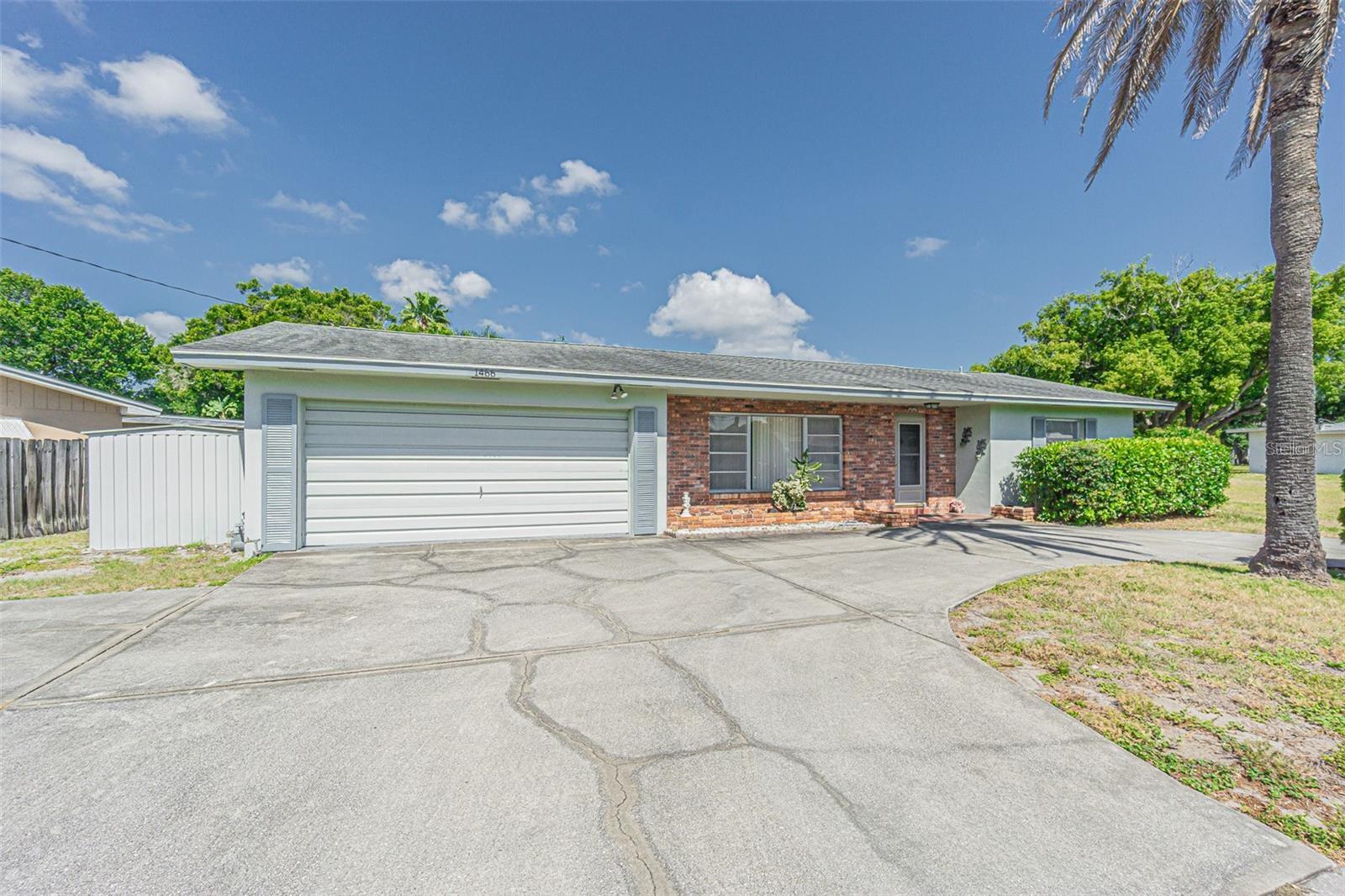 Lakefront Home for Rent in Clearwater! Discover the perfect blend of comfort and convenience in this beautiful lakefront home for rent in Clearwater, FL. The vacant lot next to it is NOT included with this property. This charming property offers breathtaking water views and a peaceful setting while keeping you close to everything you need. It has a spacious family room perfect for entertaining or relaxing with loved ones. Large Screened Porch Enjoy the serene lake views and Florida breezes year-round. Two-car garage, with Plenty of storage and parking space. Circle Driveway. Centrally located, Close to shopping, dining, schools, and entertainment. Minutes from Clearwater Beach. Just a short drive to one of Florida's most famous beaches! This home offers the ideal combination of tranquility and accessibility, whether you're looking for a peaceful retreat or easy access to the best of Clearwater.