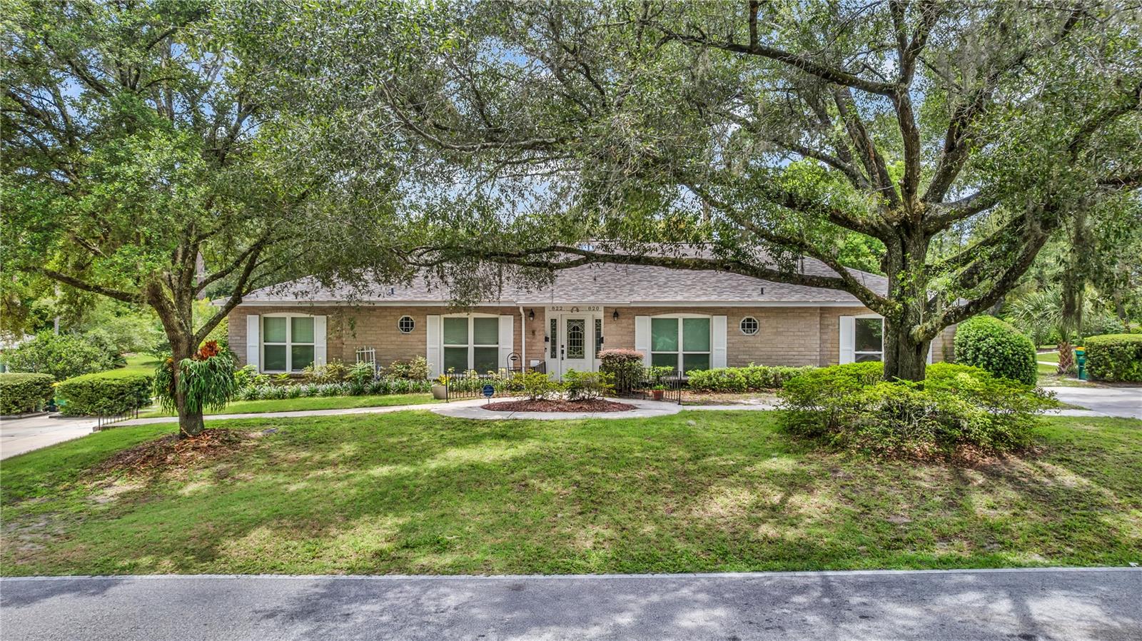 Welcome to 820 S Hill Ave – a lovingly maintained and truly special condo tucked away in one of DeLand’s most peaceful neighborhoods! Backing up to a retired golf course and surrounded by mature trees and walking paths, this 2-bedroom, 2-bath home offers 1,200 sq ft of comfort, style, and serene views. From the moment you step inside, you’ll notice the pride of ownership—ceramic tile floors stretch throughout the home, and the light, bright kitchen features granite countertops and classic light cabinetry. A rare find, this unit includes a gas range, ideal for those who love to cook! The spacious living area is perfect for cozy nights in, complete with a new electric fireplace to warm up those cooler Florida evenings. Need more space? The enclosed Florida room adds an additional 24x11 feet of sunlit living area, surrounded by windows and hurricane shutters for extra peace of mind. It's the perfect spot for morning coffee, entertaining guests, or even a second lounge or hobby space. Step outside to enjoy your private back patio overlooking nature’s best—lush landscaping, tranquil paths, and quiet surroundings. With a new roof (2024), water heater (2022), and AC approx. 7 years old, all the major components have been taken care of. This condo is truly move-in ready and waiting for its next owner to love it just as much. Don’t miss this rare opportunity—schedule your showing today and experience the charm of DeLand living! *Buyer must apply for SHOA membership. Application must include a check for background inquiry: $45 for a single applicant or $90 for a couple.*