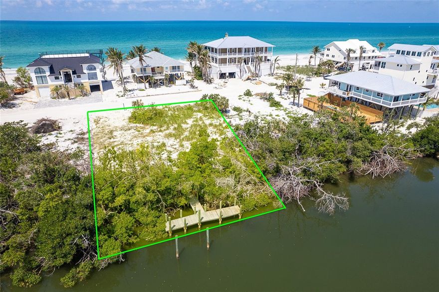 Prime vacant lot on Don Pedro-Knight-Palm Island across the sandy shell road from the beach. Lot is on Bocilla Lagoon with a dock in place.  This bridgeless, barrier island is accessible only via boat or a 4 minute car passenger ferry ride.  Situated between Sarasota/Tampa to the north and Ft. Myers/Tampa to the south.  Enjoy the remoteness of the island life and all that it affords:  fishing, swimming in the Gulf, boating, kayaking, paddle boarding, searching for shells and shark's teeth on the pristine white sand beaches, watching the glorious sunsets and just plain breathing in the salt air.  Buy your piece of island paradise today and build your dream home!!!