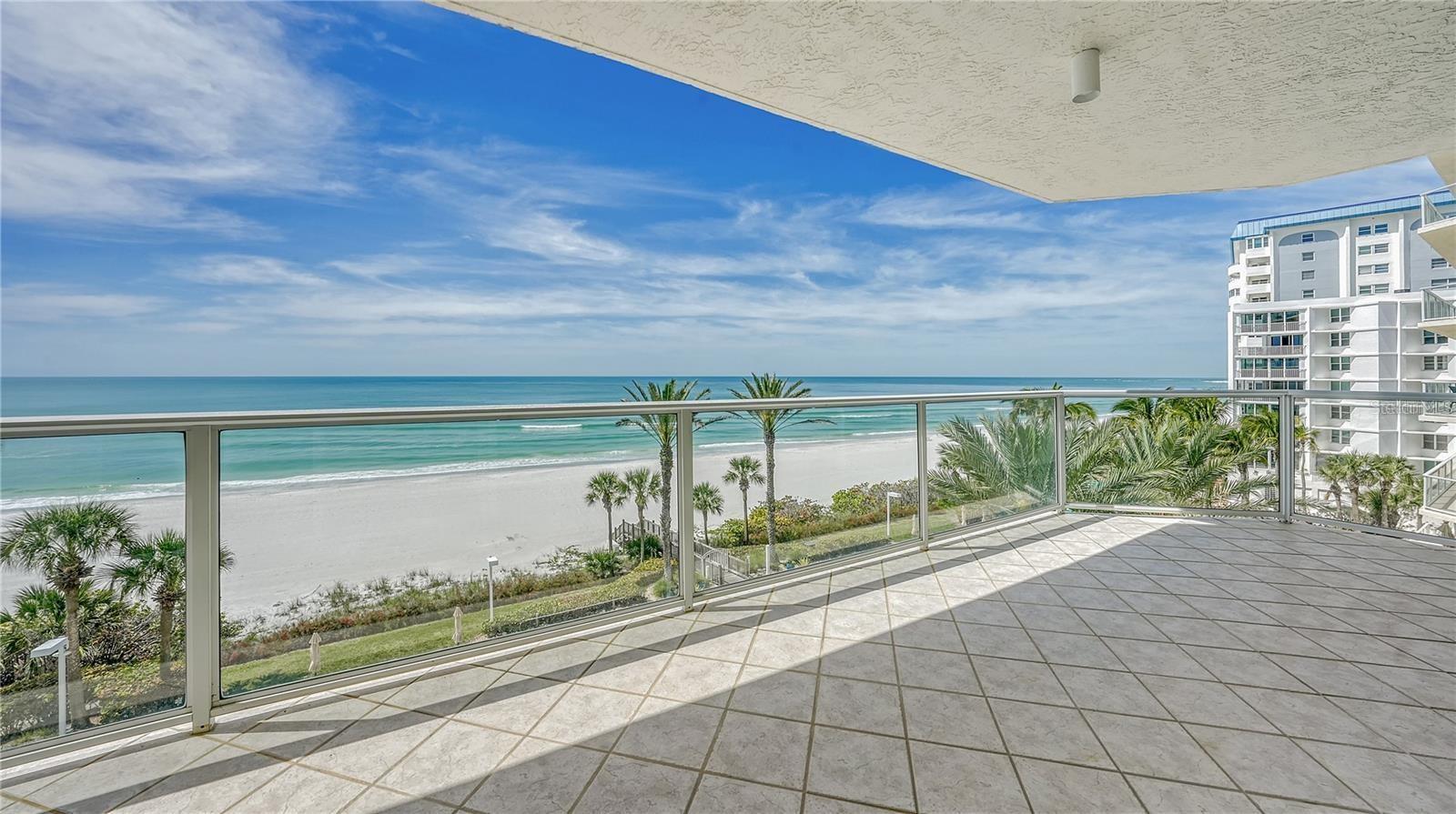 Never ending sunsets and sand - this rarely available beachfront 2 bedroom, 2 bath is waiting for you in L’Elegance on Lido Beach! Take advantage of this incredible opportunity to own a piece of paradise and make it your own. You can have it all here with shopping and dining just a short distance away at St. Armand’s Circle and sugar sand beaches on your doorstep. The split bedroom floor plan provides 2 newly carpeted oceanfront bedrooms with floor to ceiling sliders that provide an endless ocean view. The combined living and dining room areas boasts hardwood floors and leads to the 365 square foot balcony that stretches the entirety of both bedrooms and the living area. You will find yourself at home in the primary bedroom with a large ensuite bathroom and a spacious walk-in closet. The second bedroom has increased privacy with a pocket door that closes off the bedroom and bathroom with a full-sized tub. Laundry is a breeze with the full-size washer and dryer as well as extra cabinetry in the laundry room. L’Elegance offers the ultimate year-round vacation lifestyle, with a private beach on the quiet south end of Lido Key. You will love coming home every day as you enter the beautiful L’Elegance lobby with stunning water views. On the main level you will find not only a comfortable area to read a book, but also the large card room to meet up with friends. The amenities in this pet friendly community are exceptional and abundant including a heated 85-foot lap pool and spa that overlook the white sandy beach, security gate, on-site maintenance staff, building manager, extra storage area, and underground parking. Living an active lifestyle? No problem at L’Elegance with the on-site gym, sauna, locker rooms, and two tennis courts. Every evening soak in the serene sunsets from the pool deck or take the secure private walkway directly to the beach for a swim or stroll. Or just relax on your private veranda and watch the sun sink into the Gulf of Mexico. The beach is calling, and this is the condo that makes it possible to create the coastal condo of your dreams and live the Florida Lifestyle!