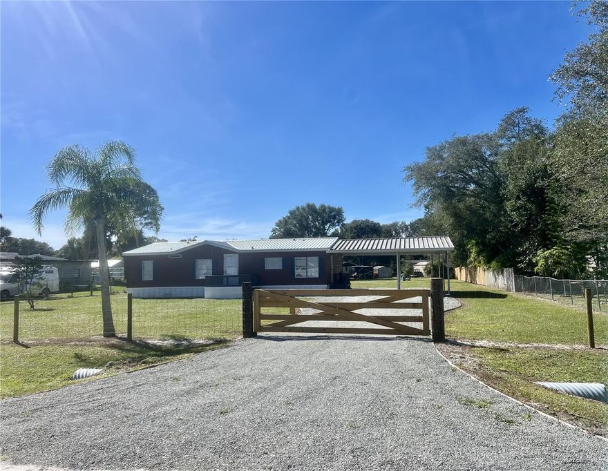 PIONEER ESTATES ~ East Side Commute. 3 Bd/ 2 Ba/ 26x27 double carport.  Lovingly remodeled split floor plan DWMH on a Half Acre+. New remodeled kitchen, sparkling cabinets, pantry, New SS appliances, bkfast nook.  Separate utility room. Fresh paint and polish! New WP Laminiate floors throughout. Beautiful New ceiling fans and lighting. 12x24 Covered back porch, same level as your new home. NEW metal roof, New water softener and New well pump. Fenced yard with new pea gravel drive and new front gate. GREAT FAMILY HOME!

Dimensions are approximate, must measure for exact.