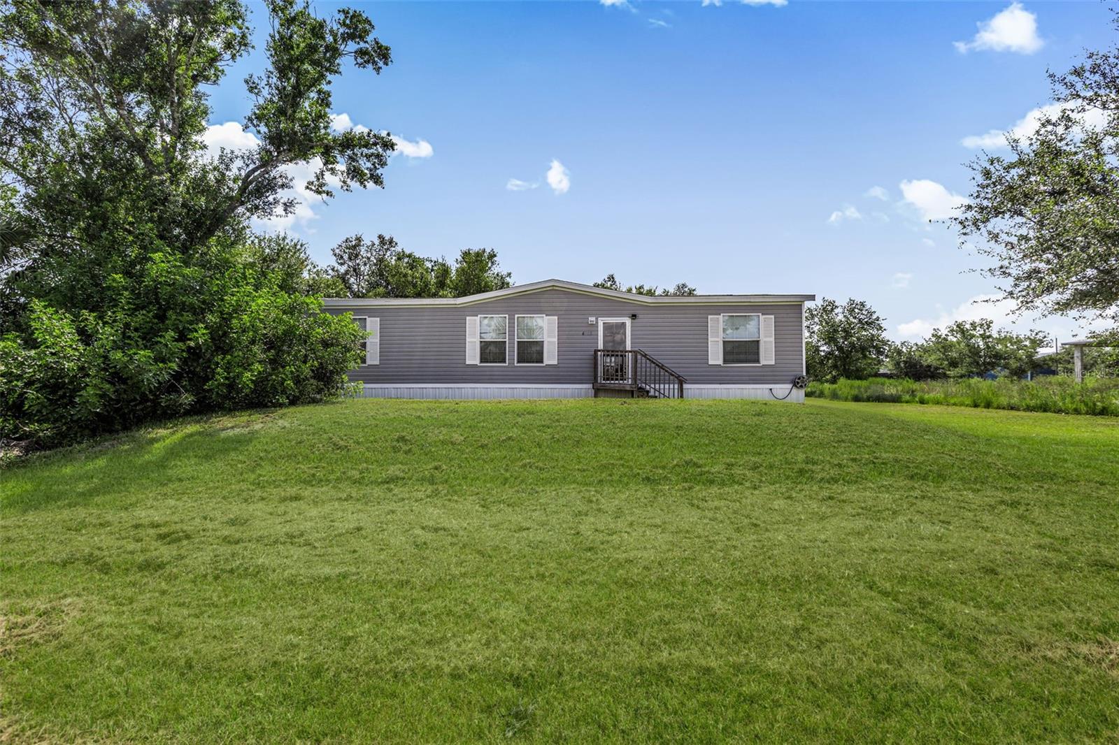 1.25 ACRES – NO HOA - NO FLOOD ZONE!
Discover the freedom and space you've been looking for with this beautifully maintained 3-bedroom, 2-bathroom manufactured home on 1.25 acres of AG-zoned land in the desirable Charlotte Ranchettes. Whether you have horses, RVs, boats, ATVs, or work vehicles—there’s plenty of room to spread out and make it your own. Want to add a barn, workshop, or pool? There's space for that too!
This move-in ready home features recently installed new skirting for enhanced curb appeal and added durability. The interior is in excellent condition and offers comfortable living in a peaceful rural setting. Equipped with WIND ZONE III-RATED WINDOWS for enhanced storm resistance.
Conveniently located just off Bermont Road with easy access to I-75, SR-31, SR-17, and downtown Punta Gorda, you're never far from shopping, dining, and local attractions—yet you’ll enjoy the privacy and freedom of country living.
With no HOA, no deed restrictions, and plenty of usable land, the possibilities here are endless.
One of the best-priced homes in the Ranchettes—don’t miss your chance to own a piece of Florida’s country charm. Schedule your private showing today!