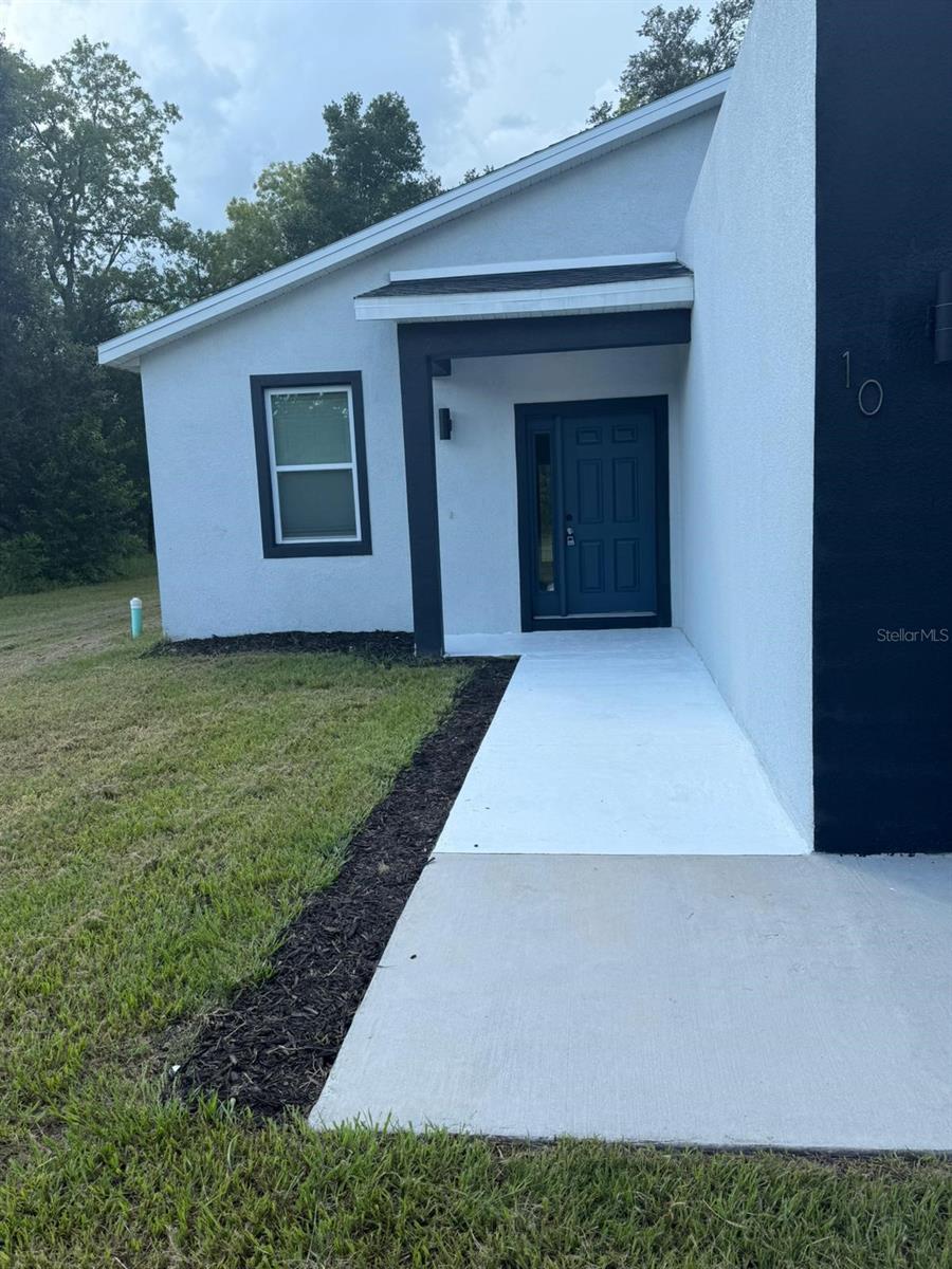 Available now! Unprecedented SMART Home with the latest Technology! Super Modern Design in the Ocklawaha area. This 3-Bedroom 2-Bathroom - Home features an open concept Living Area, a large covered Porch, a beautiful Kitchen with solid surface counters, and a convenient Mudroom and Laundry. Smart Home features include an EV car charger, UV air purification light, Alexa device, smart device Thermostat, garage door, and lighting, and a smart Electrical Panel to manage and monitor energy usage. This Home is in beautiful Ocklawaha. You can take the day off and go golfing at several local golf and country clubs nearby or shop close by at Lady Lake Commons and other major retail centers.