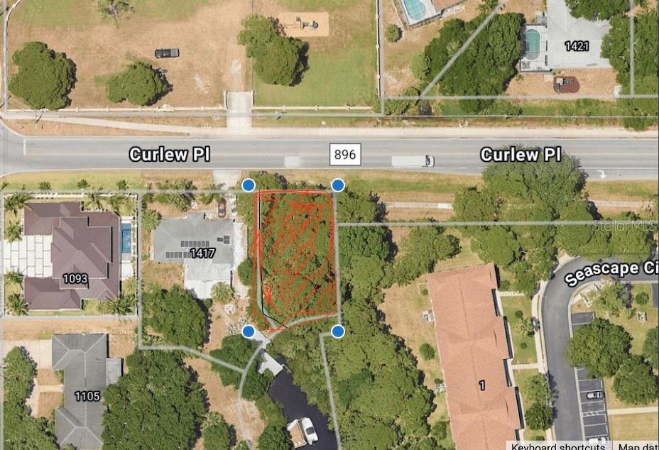 The lowest cost of entry waterfront lot you will find! Over 6,000 sq ft lot with 51' of water frontage to be cleared and start your next adventure. The Coquina Beach location provides great amenities and only your vision is needed to transform this undeveloped lot into home. Survey available upon request.