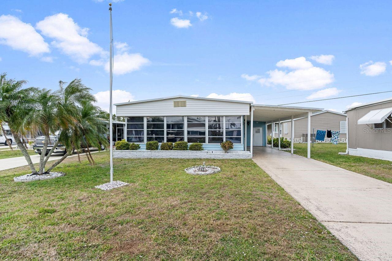 Escape to Southwest Florida in this updated 2-bedroom, 2-bath home in a 55+ waterfront community located along the Myakka River with Gulf boating access! Unbelievably affordable living with a mere $99 annual lease fee! This doublewide 768 SF residence in the pet section has an additional 220 SF enclosed lanai allowing more open space for comfortable living. All the big updates have been completed including a new metal roof, carport, A/C, and stylish vinyl plank flooring. It is furnished to allow a quick move-in and enjoyment of beautiful weather and activities. The quaint kitchen has an eat-in area and sliders to the larger dining table on the lanai. Both bedrooms have double closets and built in storage for your large collection of bathing suits and flip flops. For those that relish boating and fishing, the community has a 90-slip marina, the only one of its size in the area. Relax and socialize at two sparkling pools, spa, and huge 2-story clubhouse buzzing with dances, shows, parties, classes, and games. Optional amenities are the tennis, bocce, shuffleboard and pickle ball courts, a fitness center, woodworking shop, boat slips and storage compound. Just a short drive from area beaches, dining, shopping, spring training baseball games, golf courses and top-notch hospitals and medical services. This is the ultimate blend of relaxation, recreation, and community living. Don’t miss out on the opportunity to embrace affordable living in one of Florida's most sought-after communities! Schedule your private tour today.