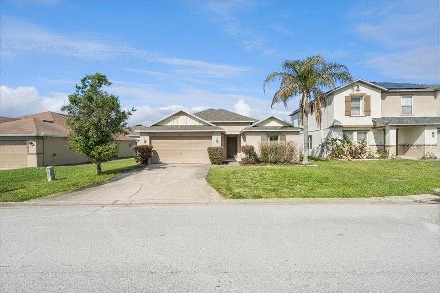 This charming one-story single-family home offers the perfect blend of comfort, functionality, and convenience! Featuring an open floorplan, the home includes two connected living room areas, a dedicated dining space, and a kitchen that overlooks the main living areas — ideal for both everyday living and entertaining. Laminate flooring throughout the living spaces adds a modern touch and easy maintenance.

The split-bedroom layout provides added privacy, with the spacious primary suite tucked away from the additional bedrooms. The primary bedroom features a ceiling fan and walk-in closet, while the en-suite bathroom includes dual sinks, a walk-in shower, and a relaxing soaker tub. The two additional bedrooms are conveniently located near the guest bathroom.

Additional highlights include a full-sized washer and dryer, attached two-car garage, and a layout perfect for both homeowners and investors alike.

Enjoy access to community amenities including a pool, playground, and basketball court, all while being near Highway 27 with endless shopping, dining, golf, and the theme parks! Whether you are looking for your next primary residence or a fantastic investment opportunity, this home checks all the boxes!
