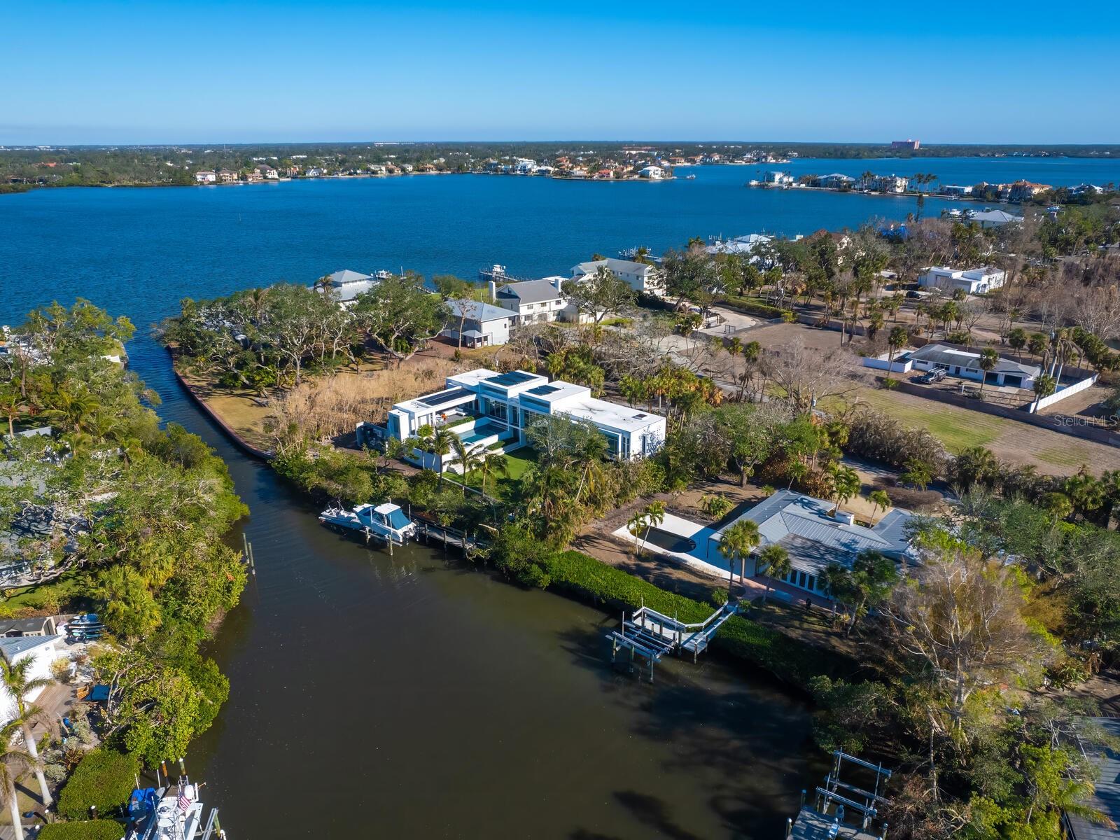 Waterfront opportunity. Discover the unparalleled charm of Siesta Key with this exceptional waterfront property. Ideally just three lots from Sarasota Bay on sailboat water, with no bridges to the bay, this property presents a rare opportunity to either renovate the structure or build your dream luxury home in one of Florida’s desired coastal communities. For boating enthusiasts, the property provides direct sailboat access to Sarasota Bay, the Intracoastal Waterway, and the Gulf of Mexico via the recently reopened Midnight Pass. Please note that the existing structure on the property was storm-damaged, has been remediated and is ready for renovation. The property is being sold for land value, offering a unique opportunity to create your custom waterfront estate on the private, nearly one-half-acre property. Outside the gates, yet part of the Sanderling Club, residents enjoy a serene lifestyle with access to social events and a private community beach where, each evening, the Gulf of Mexico paints the sky with breathtaking sunsets, creating a picture-perfect backdrop for relaxation. This property is more than just a piece of land, it’s an invitation to embrace the beauty, luxury and convenience of coastal living. Conveniently close to Siesta Key’s world-renowned crystal quartz sands, Turtle Beach, and the vibrant dining and shopping scene of Siesta Village and the South Village. Just a short drive away, downtown Sarasota offers a wealth of cultural attractions, including theaters, ballet, opera, museums and art galleries.