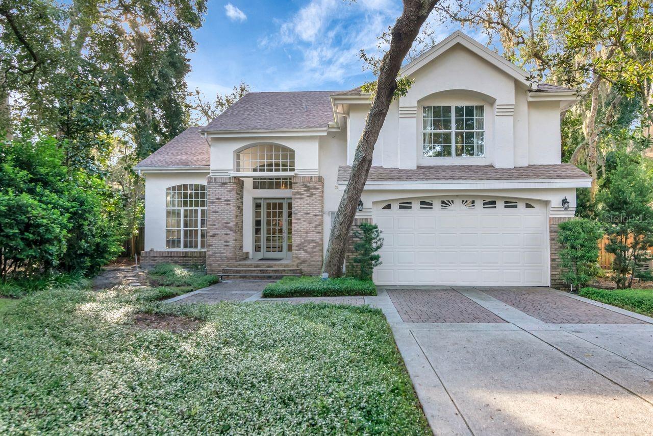 Welcome to an exceptional opportunity in the prestigious gated community of Magdalene Reserve. Nestled at the end of a quiet cul-de-sac and surrounded by mature, winding oak trees and lush landscaping, this beautiful property offers a rare combination of space, privacy, and unique features. It is the only home in the community that includes a detached guest house with private access from the rear street. Both the main house and guest house have newer roofs, providing added value and peace of mind for years to come. As you enter through the grand foyer, a dramatic spiral staircase and elegant balcony make an unforgettable first impression. To the left is a formal living area with soaring 12-foot ceilings, while to the right is a spacious bonus room—perfect for a home office, playroom, or media room. Gleaming hardwood floors run throughout the home, complementing its timeless design. The large laundry room includes a washer and dryer for added convenience. The heart of the home is the inviting family room, featuring custom built-in shelving surrounding a beautiful marble wood-burning fireplace. Expansive sliding glass doors open to a serene outdoor space with a sparkling saltwater pool and spa—perfect for relaxing or entertaining. Adjacent to the family room is a chef-inspired kitchen complete with granite countertops, stainless steel appliances, a gas range, warming drawer, prep island with sink, large refrigerator, ample cabinetry, walk-in pantry, and a bar-height counter for casual dining. A formal dining room sits just off the kitchen and also provides sliding door access to the pool area, creating an effortless indoor-outdoor flow Upstairs, you'll find five generously sized bedrooms. The luxurious master suite features two walk-in closets and a spa-like bathroom with dual vanities, a soaking tub, and a walk-in shower. The detached guest house offers approximately 600 square feet of living space, including one bedroom, one bathroom, and a private one-car garage—ideal for guests, extended family, or even potential rental income. Additional features include a saltwater chlorinator system for the pool (leased), a leased propane tank for the kitchen range, an A/C system replaced in 2017, a hot water heater replaced in 2020, a pool pump updated in 2016, and a whole-house water treatment system that is installed but currently not connected. This home is filled with charm and ready for your personal touches. Don’t miss the chance to own one of the most unique and desirable properties in Magdalene Reserve. Schedule your private tour today!