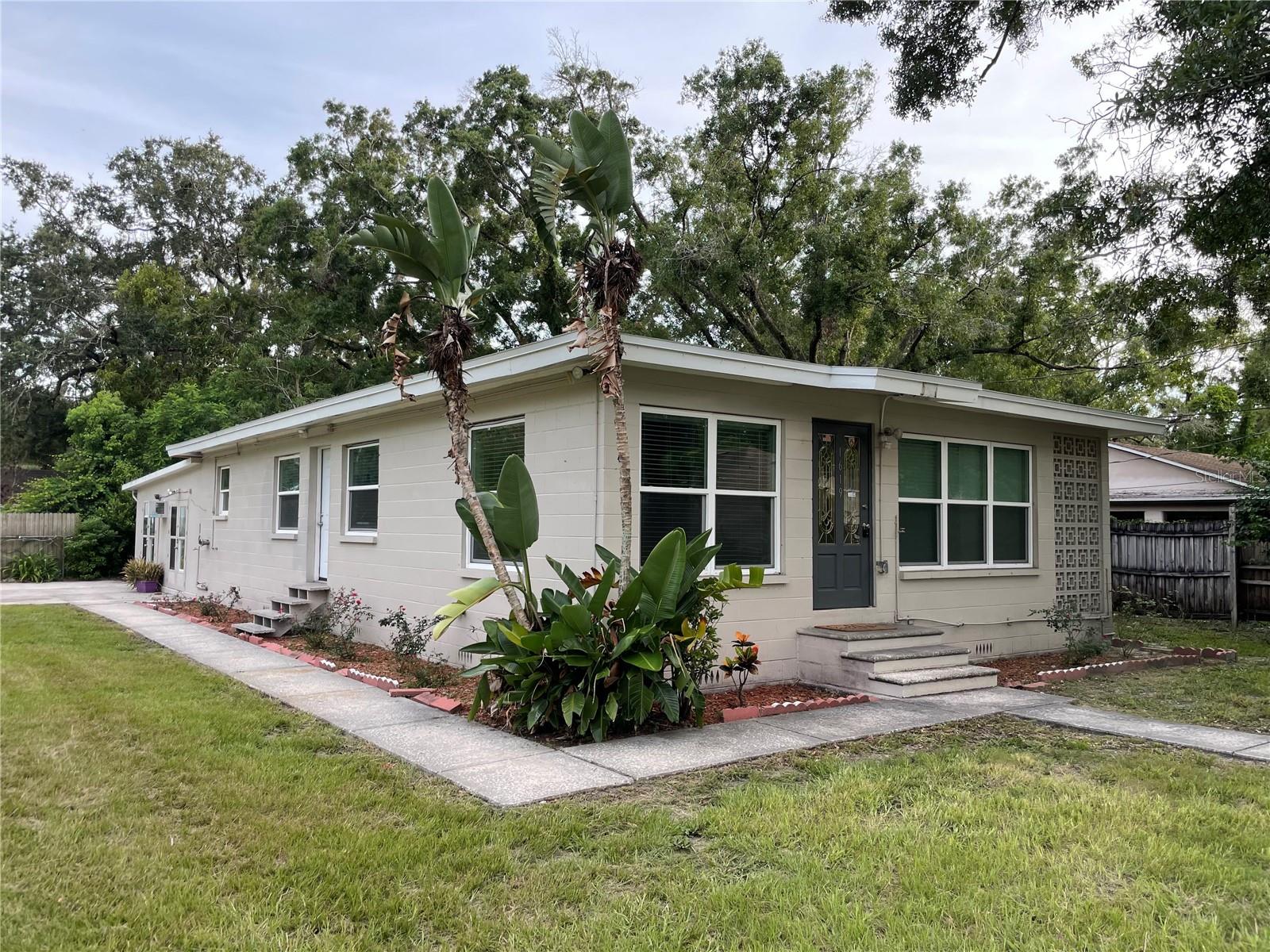 One or more photo(s) has been virtually staged. BACK ON THE MARKET WITH A NEW HVAC AND NEW ROOF!! With two lots, 284/285 over a 9,000 sq ft corner Lot Property. This 4-bedrooms, 2-bathrooms, 4 cars Parking driveway-room for boat parking. Living Room, Dining Room and Eating-Kitchen. The home has a bonus room , could be use as an in-law suite or rental income space. The spacious extra room with a full laundry hock up. While the home may need some TLC. Located near the scenic Hillsborough River and the lush greens of Roger Park Golf Course, this property promises tranquility and recreation at your doorstep. Plus, with no flood zone concerns, it's a secure investment for rental or personal enjoyment. This home qualifies for the City of Tampa down payment assistance! Waiting for a Savvy buyer action to convert in to a multiple rental income. Smart Buyer bring your Ideas......