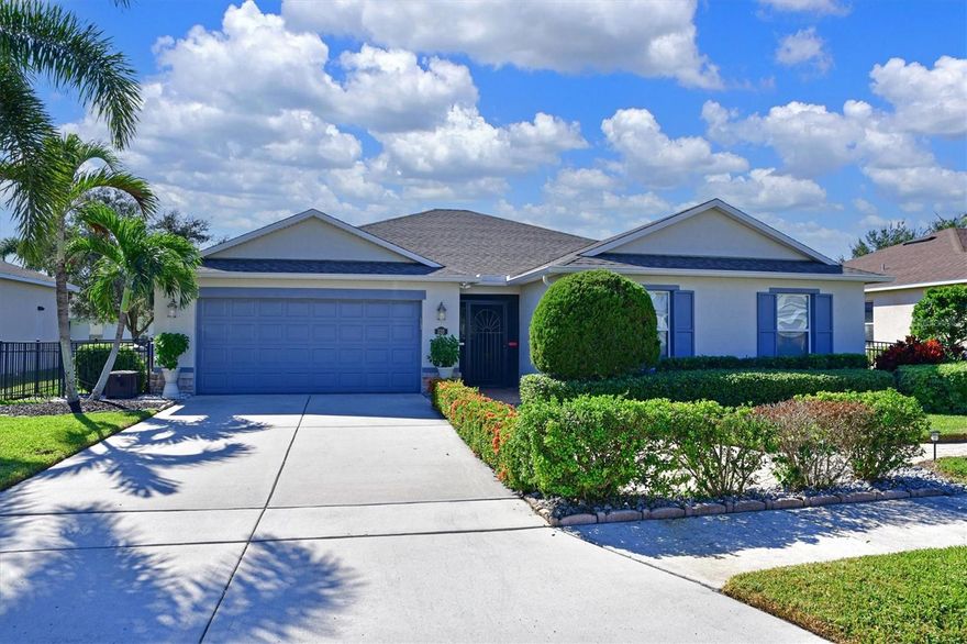 This former builder’s model is ready to welcome you home to enjoy life in paradise.  This home offers an open floor plan with 3 bedrooms, 2 bathrooms and a den. Enjoy making memories as you gather in the oversized great room boasting a formal dining area with the aroma of freshly baked cookies coming from the kitchen. The kitchen features stainless steel appliances, solid wood maple cabinets, walk-in pantry, built in oven and microwave.  Included also is a reverse osmosis water filtration system for perfect drinking water. The desirable split floor plan allows for privacy for everyone. Updates include fresh exterior paint, new luxury vinyl plank floors, new refrigerator and a new reverse osmosis water filtration.  For convenience the mulch has been replaced with rubber mulch. Enjoy the beautiful weather outside relaxing in the screened lanai or the brick paved patio. The fully fenced yard is a bonus for your furry loved ones. Your new home also comes equipped with electric car charging outlet and portable generator.