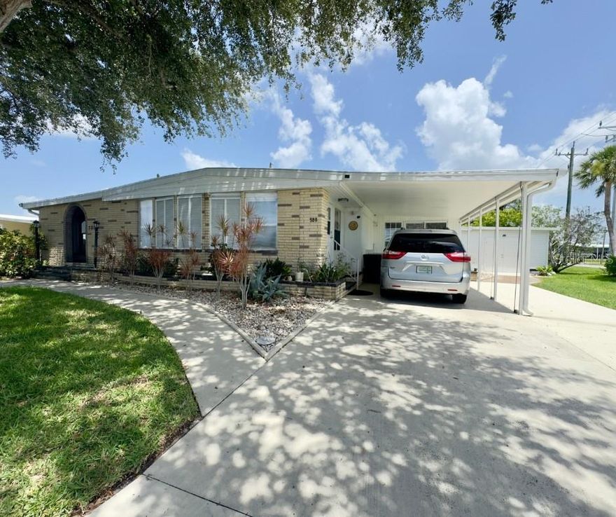 HUGE & BEAUTIFUL HOME on a CORNER DOUBLE LOT! Over 2,300 Sq Ft of Stylish, Updated Living! Discover the space, comfort, and upgrades you’ve been looking for in this expansive double-wide home sitting proudly on a rare corner double lot! With over 2,300 square feet of living area, this home offers room to relax, entertain, and live your best life. Step into the updated, modern kitchen; solid wood cabinets, granite counters, stainless steel appliances—perfectly designed with today’s finishes and functionality in mind. Expansive master bedroom, offering plenty of room for a king-sized bed and a sitting area. You'll love the oversized walk-in closet, providing ample space for organizing and storing your entire wardrobe with ease. The luxurious master bathroom features generous proportions and is designed for comfort, complete with a large vanity, walk-in shower, and plenty of natural light. Your guests will feel right at home in this generously sized guest bedroom, perfect for comfort and privacy. Featuring a large walk-in closet, there’s plenty of storage space for extended stays or extra belongings. Whether used for guests, a home office, or a second master, this versatile room offers both function and flexibility in a beautifully designed space. Three full, beautifully updated bathrooms, an indoor laundry room conveniently located just off the enclosed porch, and no shortage of space or style. Enjoy the charming screened-in porch for bug-free evenings and a sunny open patio for gatherings under the sky. The home’s exterior stuns with its brick façade, Bahama shutters, and corner-lot presence. This home is beautiful—it’s built to last, with major system upgrades including a 2023 roof, 2022 HVAC mini-split system and ductwork, 2021 water heater, newer electric box, plus a new vapor barrier and tie downs for added protection and peace of mind. Don’t miss your chance to own this one-of-a-kind property with unbeatable space, updates, and curb appeal. Experience the best of Florida’s retirement lifestyle; Harbor Cove, a sought-after 55+ waterfront community along the scenic Myakka River, filled with resort-style amenities. Low monthly HOA fee of just $150 a month! Includes access to two sparkling heated pools, a relaxing spa, a well-equipped fitness center, a clubhouse overlooking the stunning marina, shuffleboard, horseshoes, pickleball, tennis, and bocce courts. Socialize and stay active with dances, parties, water aerobics, fitness classes, art classes, woodworking, golf cart parades, bingo, dances, and more. Boat clubs, a craft room, picnics on the patio, golf clubs, bowling clubs and much more. There is plenty of wildlife to enjoy in this 190-acre community; herons, egrets, cranes, ibis, parrots, even alligators and manatees! Conveniently located within minutes of Downtown Wellen Park, Costco, shopping, restaurants, and a short drive to beautiful Gulf Beaches. Schedule a viewing today and let this dream home become your reality!