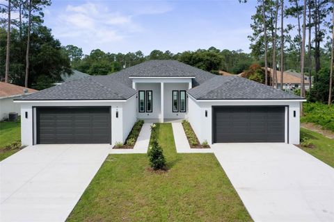 Photo of 76 Rickenbacker Drive, Palm Coast, FL 32164 (MLS # FC311597)
