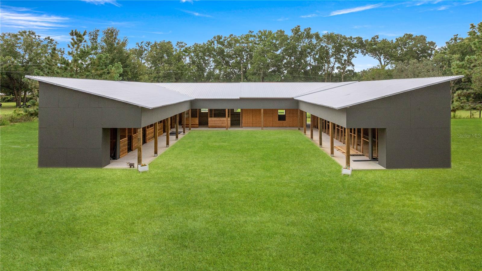 One or more photo(s) has been virtually staged. Under Construction. 2 MILES TO THE WORLD EQUESTRIAN CENTER. NO HOA. NO FLOOD ZONE. THE HARD WORK IS DONE! THIS PROPERTY IS READY TO BE FINISHED TO YOUR SPECIFICATIONS. WHY RENT THIS SEASON WHEN THIS BEAUTY COULD BE READY TO GO!? AG EXEMPT AG-08 (4 HORSES PER ACRE) ALREADY! This beautiful property offers over 3 acres of usable land just minutes from WEC. The barn is currently under construction and includes a rough plumbed 2 bedroom, 1 bathroom apartment with a full kitchen/ living area—ideal for owners or rental income. The barn features 5 finished 12x12 stalls & 2- 12x16 stalls with room for 5 more 12x12. Additional features include a metal roof rated for 180 mph winds, 10x12 storage room and a 16x16 tack/feed room. Outside, you'll find a 60 ft round pen, a riding arena, three established pastures, & plenty of space to create more. This is a rare opportunity to own a versatile, horse-friendly property in a prime location—schedule your showing today! * NO owner financing, site unseen or verbal offers will be considered*