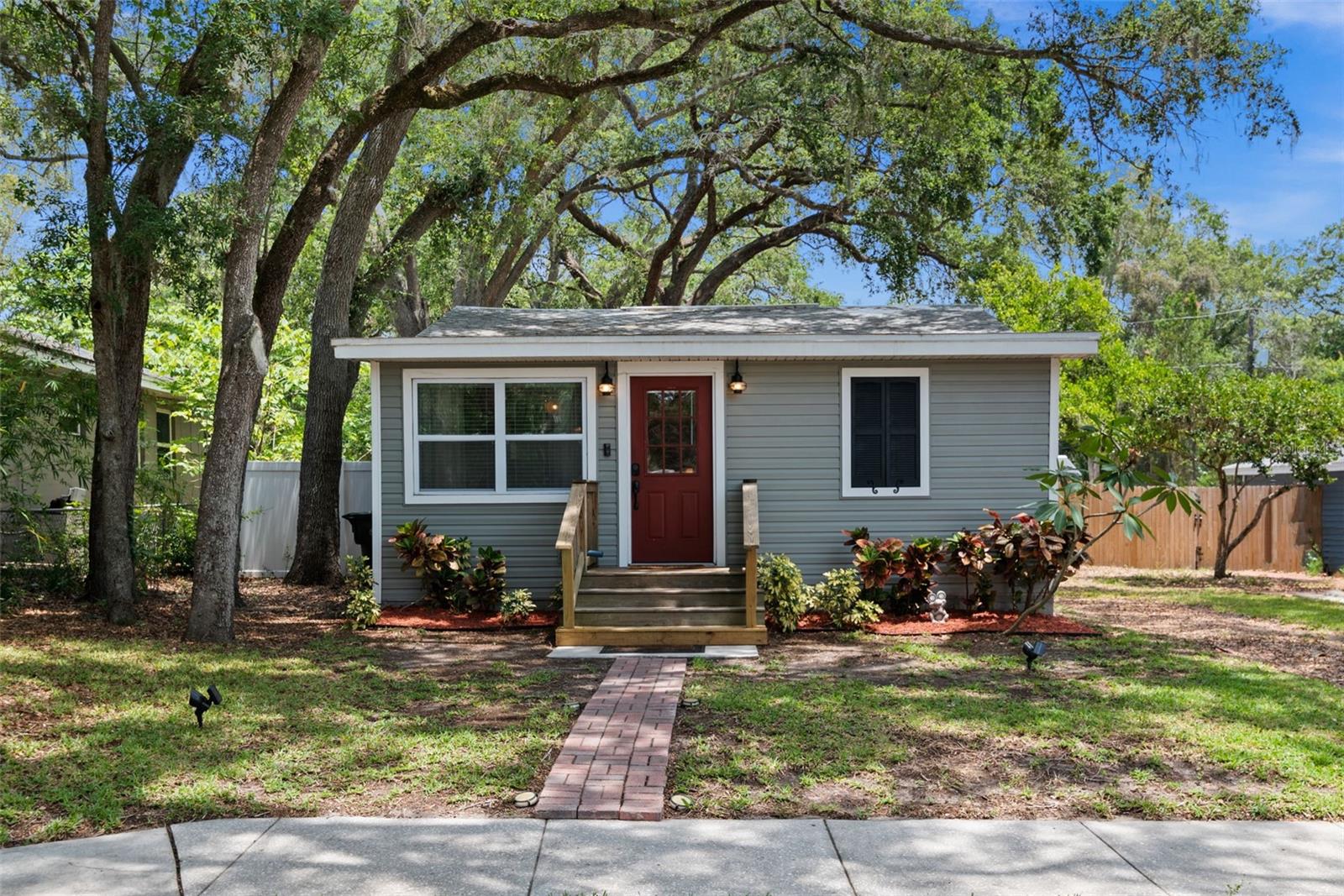 Centrally located RENOVATED cottage with in 10 minutes the beach!! Welcome to this absolutely adorable 3-bedroom cottage giving you incredible features and value. The Newer renovation includes the galley style kitchen with shaker cabinetry, granite counter tops, as well as a full stainless appliance package. Luxury Vinyl Plank flooring throughout, easy cleanup for the active Florida lifestyle. Well-designed use of space in the 2nd half bath to house the inside laundry and water heater. Living and dining areas are spacious and flexible based on your family’s needs. This home has had the electric and plumbing updated in 2016, AC 2016, Energy Star, dual pane, Low-E, High Velocity Hurricane Zone windows 2016. The home has new insulation in the walls and above the ceiling, and new vinyl siding on the outside, also 2016. Energy saving features though out the entire home are fantastic and well thought out. Boats, Dogs, Rv’s no problem in your fully white vinyl privacy fenced back yard. Eight-foot gate on the side of the home for convenient entry and exit. The perfect outdoor patio is wonderful for guest and entertaining as well as a relaxing glass of wine at the end of a busy day. The property does abut the alley and fencing could be opened for alley access if someone wishes. The property does have a storage shed and room to store personal items like kayaks and outdoor items. Property is tenant occupied until 8/18. This means an appointment is required, please call or text listing agent for more details.