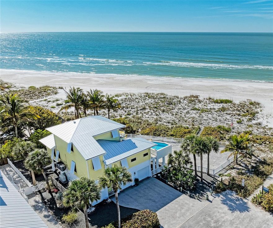 A beachfront paradise with a raised pool, offering stunning gulf views and unparalleled luxury. Imagine waking up to the sound of waves and enjoying a refreshing swim in your exclusive elevated pool. This is beachfront living redefined. The sounds of an oasis! Being in a monthly rental zone ensures a serene atmosphere, adding to the peace and tranquility of this beachfront escape. Are you ready to experience the bliss of coastal living? Picture panoramic gulf views from every angle, with daily spectacles of sunsets over the water. It's a visual feast that complements the luxury within. Intrigued? Some fantastic features to mention are an elevator for seamless access, a reliable generator for uninterrupted comfort, and not just one but two primary suites for ultimate luxury. This beachfront house is designed for elevated living and built by Brent Whitehead himself. In addition, the garage has a workshop, extra space for a golf cart, ideal for coastal convenience and easy exploration and separate entries for each of the two car spaces. Impeccably cared for a new roof was put on in 2017, and there’s roll-down hurricane shutters for protection from the elements. Anything else on your mind about this stunning beachfront property? Do not hesitate to call and book your private viewing appointment where we can share more about this beachfront gem.