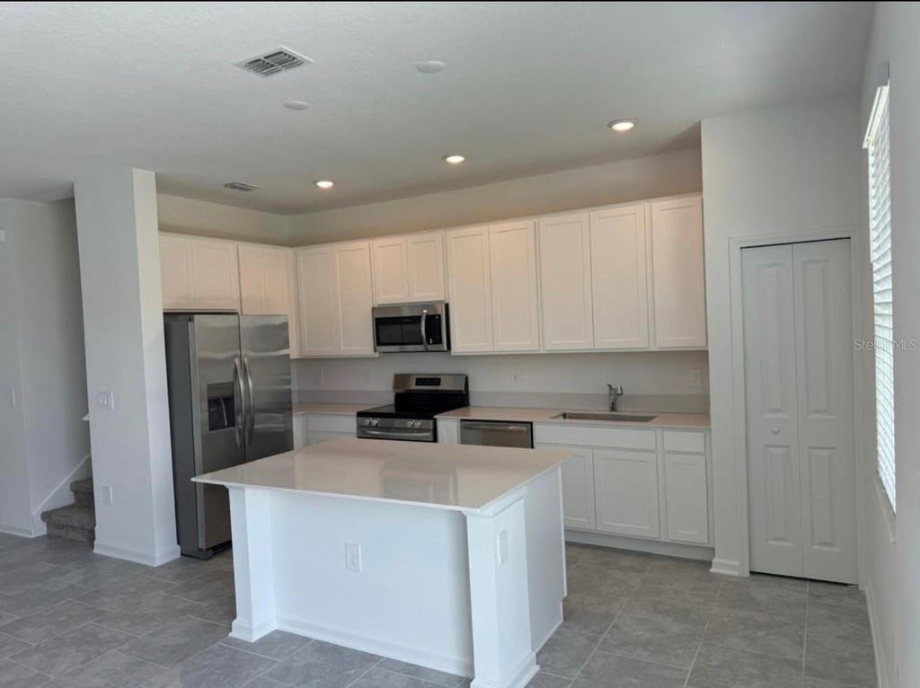 Photo of 3223 Laurent Loop, Davenport, FL 33837 (MLS # O6453517)