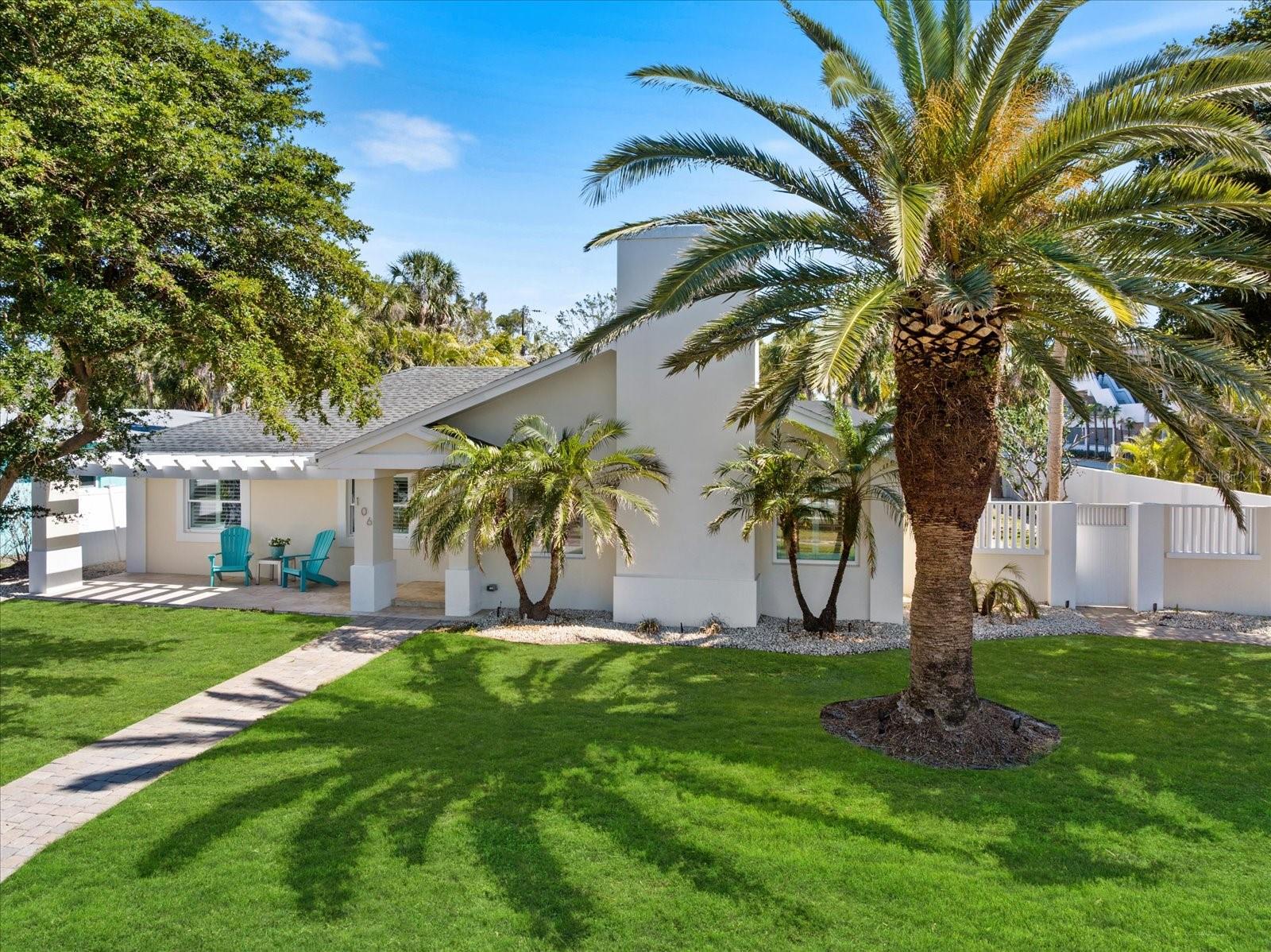 One or more photo(s) has been virtually staged. Experience the best of coastal living and investment opportunity with this beautifully renovated island retreat, ideally situated in the heart of St. Armands Circle on a oversized corner lot. Whether you're looking for a permanent residence or a high-demand vacation rental, this pristine home delivers both luxury and flexibility. The sunlit, open interior features custom carpentry, detailed moldings, and stylish coastal design throughout. Recent upgrades—including a new roof, impact-rated windows and doors, a fully remodeled kitchen, updated HVAC, pool pump, and water heater—provide modern comfort and long-term efficiency.
Relax by the screened-in pool, host gatherings in the spacious living areas, or enjoy al fresco dining on the private patio. Just minutes from Lido Beach, world-class dining, upscale boutiques, and the vibrant arts and culture of downtown Sarasota, this home is perfectly positioned for an elevated lifestyle or lucrative rental income. Whether you're living in it full time or offering it as a luxurious getaway, this coastal haven embodies the essence of relaxed island elegance.