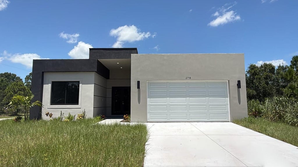 Photo of 2718 51st Street W, Lehigh Acres, FL 33971 (MLS # O6442868)