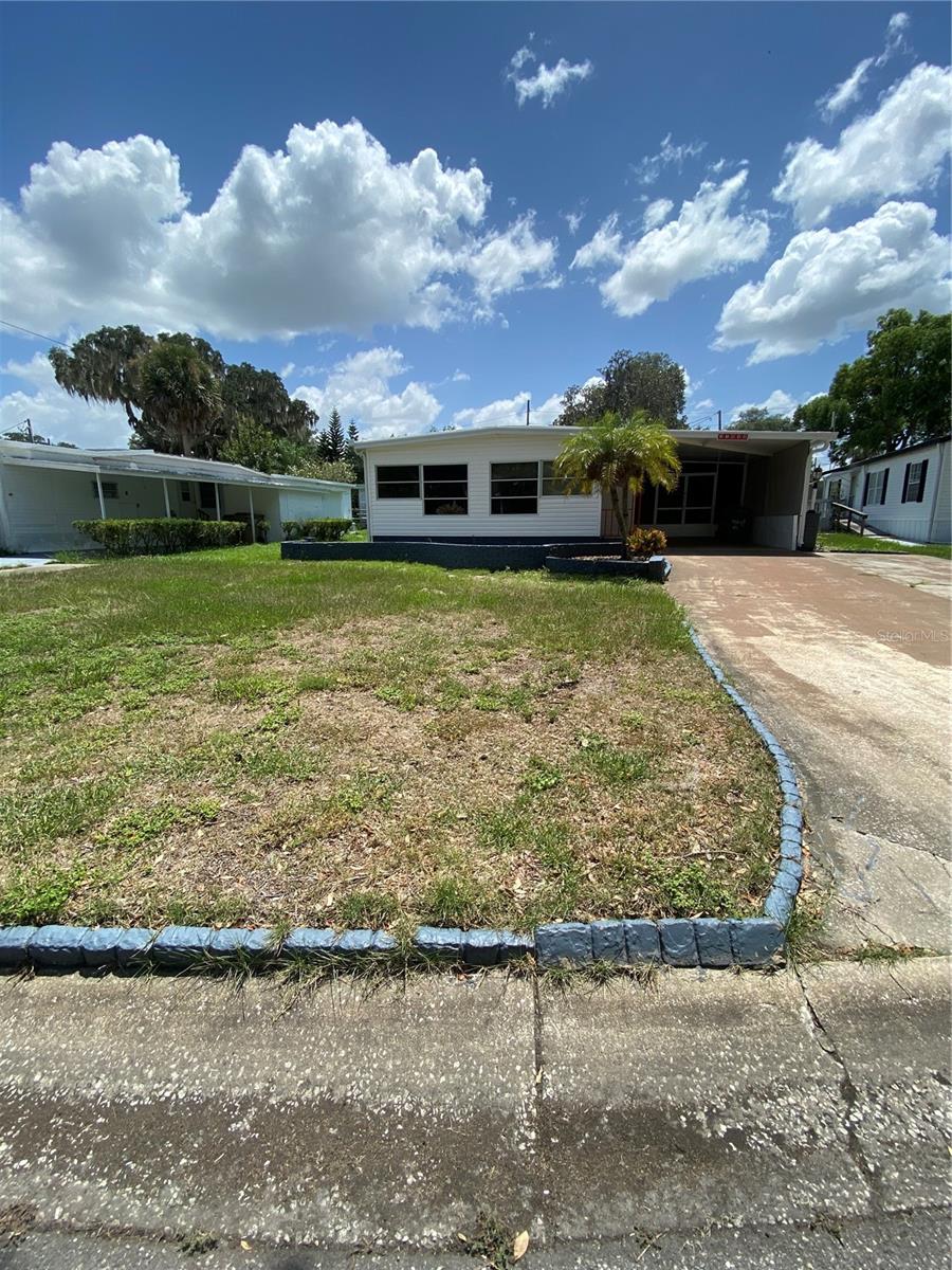 Welcome to this very cute, well maintained 2/2 mobile home in Imperial Mobile Terrace with access to the Chain of Lakes. It is in a 55+ community with an indoor heated salt water pool. The home is fully furnished and everything in the home will stay. The laundry room is outside but inside the screen room. There are 2 sheds out back for your yard equipment or extra storage. Schedule your showing today!