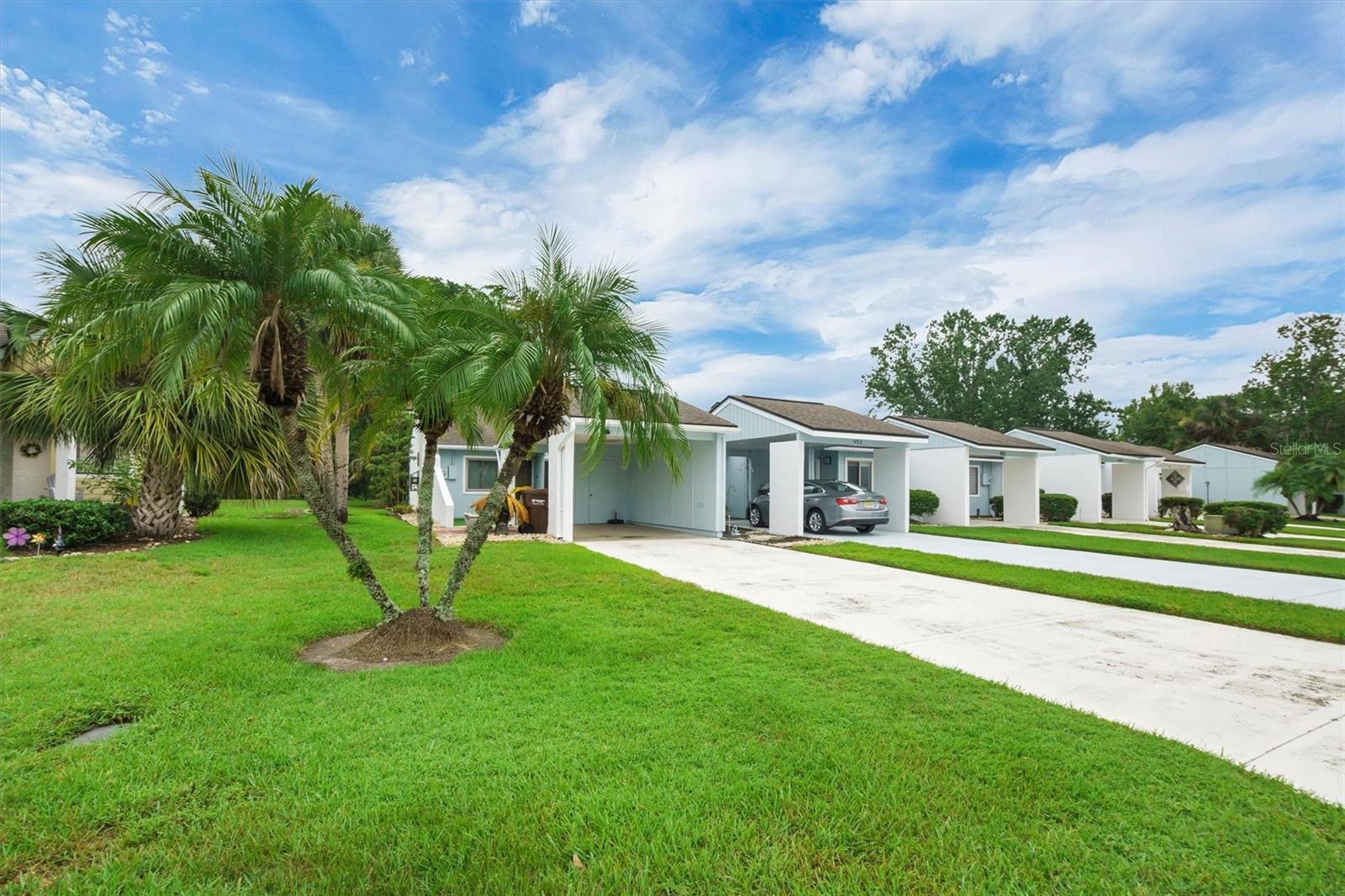 Completely renovated and move-in ready, this two-bedroom, two-bath condo offers comfort, style, and convenience in one of Kissimmee’s most accessible locations. Inside, you’ll find an open layout with a beautifully updated kitchen featuring Corian countertops and newer cabinetry. Natural light fills the space through three skylights, creating a bright and welcoming atmosphere. Both bedrooms feature walk-in closets, and the primary suite includes a fully remodeled bathroom with upgraded fixtures and Bluetooth-enabled lighting. The tiled, enclosed patio is accessible through sliding glass doors from both the main living area and the primary suite, offering a private and peaceful place to unwind, complete with three ceiling fans and views of the landscaped backyard.
This home has been thoughtfully updated with weatherproof windows, a newer roof, and an upgraded water heater. The laundry room has also been redone in the last few years, providing added function and ease. Everything has been well-maintained, so you can move in with confidence and start enjoying your new space right away.
Located close to everyday conveniences like Publix, and local shopping and dining, this condo is also just a short drive from Disney, Universal, Old Town, Fun Spot, and the water park at Margaritaville. Whether you're looking for a primary home, vacation getaway, or investment opportunity, this one checks all the boxes.