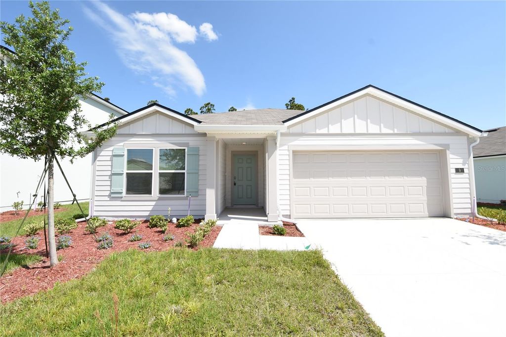 Photo of 9 Springwood Drive, Palm Coast, FL 32137 (MLS # FC318140)