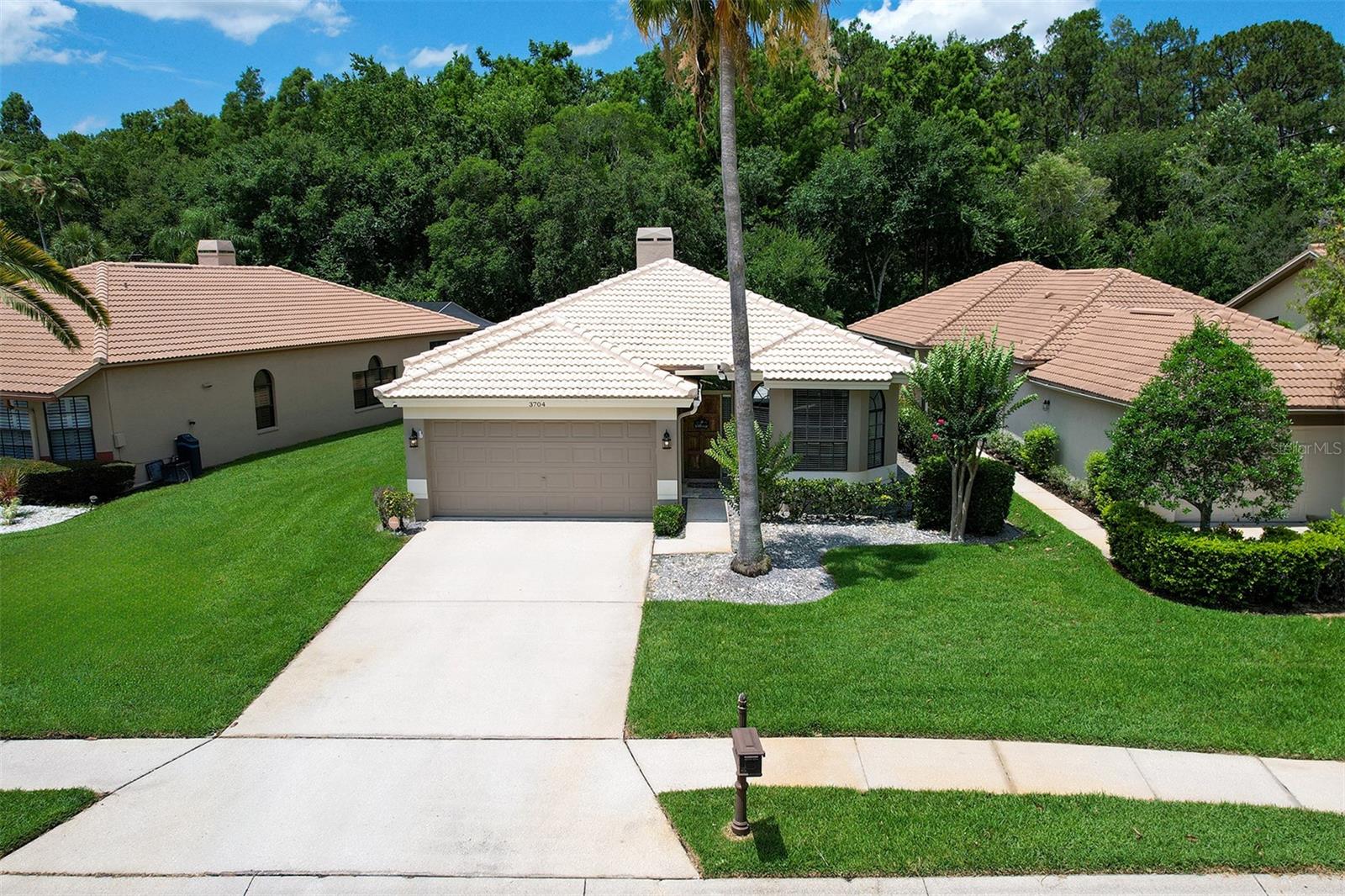 Welcome to the desirable Chattam Landing community off East Lake in the Ridgemoor corridor of Palm Harbor, Florida. This pretigious gated community consists of conservation or waterfront pond lots with all tile roof homes. This beautiful 3 bedroom 2 full bath pool home on a conservation lot has been tastefully updated in 2024 to include a completely gutted and renovated primary bath with walk-in shower, stand alone tub, all new tile and paint; new quartz kitchen counter tops with matching new quartz backsplash; new LG refrigerator, stove, microwave, new sink, faucet and garbage disposal; new LG washer and dryer in laundry room; new 6 panel doors with brush nickel knobs, 2 new barn doors and new French doors; new luxury vinyl plank (LVP) flooring consisting of key features that include anti-microbial, scratch and stain resistant wear layer, premium rigid vinyl waterproof core and easy locking installation/panels; new 6" baseboards in main living area, kitchen and laundry; all new chandeliers and LED lighting; new ceiling fans throughout; refaced fireplace in living room; all new blinds and valances on windows and new curtains; freshly painted throughout; renovated and resurfaced pebble tech gunite pool with new electric pool heater and all new lanai pavers throughout the covered lanai and screened pool area; new pavers on front stoop; interlocking PVC garage tile flooring, electric car outlet in garage; wired for security and cameras (one on front of home); new tile roof 2017; new HVAC system 2020; new hot water heater 2023; new water softener 2024, exterior painting Spring of 2024. LOW Homeowner's association monthly fees include landscaping, tree trimming, grass cutting, lawn spraying, irrigation maintenance and repair, trash removal, sidewalk maintenance, exterior home painting and private road paving. Ridgemoor Park provides you access to basketball and tennis courts and a playground surrounded by a conservation area with a pond and plenty of parking. Schedule your private viewing today. All room sizes have been measured but are deemed to be approximate.