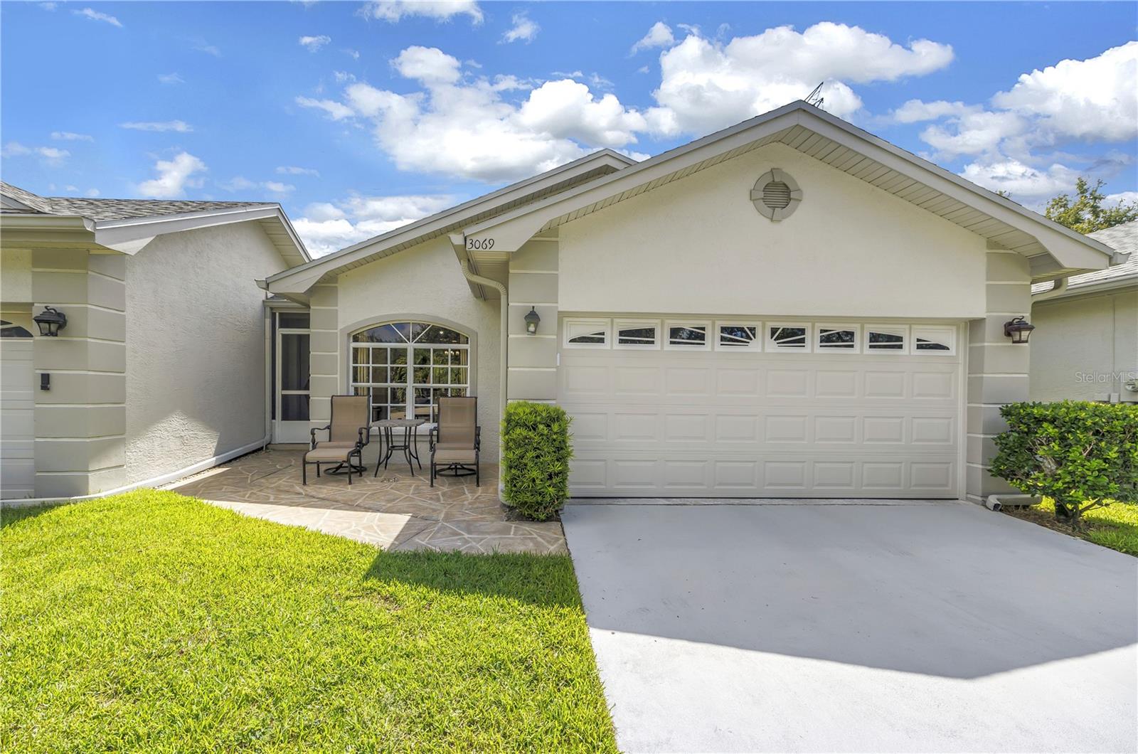 Welcome to Brookfield – a peaceful, pet-friendly neighborhood in the heart of central Pinellas County! This vibrant community offers a resort-style lifestyle with two pools and spas, a clubhouse, and tennis & pickleball courts—perfect for staying active and social. This home is ideally located just steps from the quiet cabana pool, where you can enjoy shady relaxation and year-round swimming in the heated pool and spa. Enjoy one level living with an attached 2 car garage. Spacious, open layout with vaulted ceilings for an airy, inviting appeal. Hurricane-rated skylight (2023) brings in beautiful natural light. The kitchen has been updated with white shaker cabinetry, granite countertop and newer stainless steel appliances. A Bay window creates an appealing breakfast nook in the kitchen while the breakfast bar connects the kitchen to the living/dining space. An oversized great room with plenty of space for large furnishings and entertaining your friends and family. Primary suite features: updated private bath, double vanity, walk-in, glass enclosed shower, soaking tub and generous closet space. 2nd bedroom is down a private hallway near the updated guest bath. 3rd bedroom is connected to the primary suite — perfect for a home office, nursery, or private den. Sliding doors open to the screen-enclosed covered lanai and outdoors a paver patio is surrounded by lush Areca palms where the fully fenced backyard is ideal for pets or peaceful outdoor living. Pet-Friendly & Low-Maintenance Living: 2 dogs and cats are allowed. The $310 HOA monthly fee includes Roof replacement, Exterior painting, Fence maintenance, Grounds maintenance, Sprinkler maintenance, Subterranean termite treatment, Trash removal & sewer. Convenient Location: Minutes from Countryside Mall, 12 miles to Clearwater Beach, 20 miles to Tampa International Airport, and 11 miles to St. Pete–Clearwater Airport. Notable Upgrades: Washer/Dryer (2023), Range (2023), Refrigerator (2024), Hurricane-rated garage door & opener (2023), Water heater (2020), HVAC system (2017), Roof (2023), Skylight (2023), Exterior paint (2023), Updated ceiling fans and fresh landscaping. This home offers the perfect blend of comfort, convenience, and community. Don’t miss the chance to make it yours!