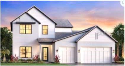 Under Construction. Estimated completion August 2025. Step into luxury with a stunning kitchen featuring a designer backsplash, upgraded cabinetry, and sleek countertops. The spacious primary suite is your personal retreat, featuring an elegant tray ceiling and a serene bathroom sanctuary. Designer finishes elevate every room, while the open-concept layout seamlessly connects the great room, casual dining area, kitchen, and covered lanai—ideal for both everyday living and entertaining. Relax in your private pool and spa while taking in breathtaking views of the water and the tranquil preserve beyond.