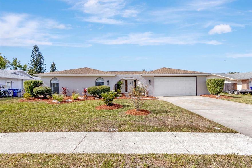 3/2/2 POOL HOME. Don’t miss this spanish-style executive home straight out of a magazine. Picture yourself entertaining family in this open chefs kitchen leading out to the huge bird caged pool or sunken family room with wood-burning fireplace. The kitchen boasts white Quartz countertops, stainless steel appliances, led recessed lights, crown molding, and subway tile backsplash.  The 2 large bathrooms have been redone from top to bottom(marble sinks, porcelain & glass tile). There are new ceiling fans and light fixtures thru-out. Custom stone and shiplap fireplace mantle.  . Newer A/c, roof and pvc privacy fence. New LVP distressed wood flooring throughout entire living space, New Window Treatments, New 5 1/2" Baseboards, New 6 panel doors with hardware, and new neutral-paint inside & out. Fresh landscaping and the Sprinkler System has been updated and has new timer. Large, newly screened pool area with a large covered area to entertain the family. The Pool has been resurfaced within the last couple years. New water heater and a new pool pump. Minutes to gulf beaches, Anclote fishing pier and historic Tarpon Springs. THIS ONE WON'T LAST!!!