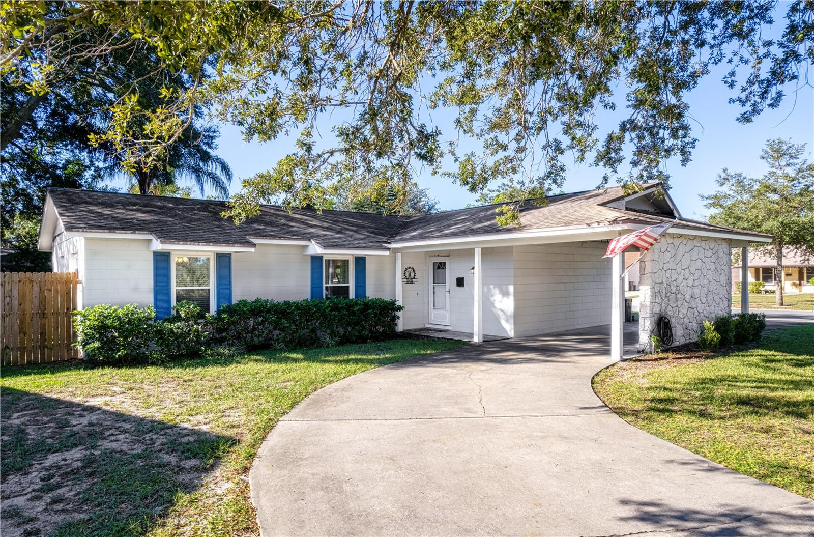 Lovely 3 bedroom 2 bathroom Florida home with all the charm! Nestled on a corner lot with circular driveway and carport! The interior boosts bright open floorplan with laminate wood flooring throughout, updated kitchen with wood cabinets and stylish countertops , shiplap wall in living area, spacious master bedroom with amble closets walk-in and standard, the master bathroom has large shower with adorable built-in vanity, double paned energy efficient windows in 2014, electrical panel in 2018, updated piping in 2013, roof in 2011, and A/C unit in 2019. The inviting backyard features a screened lanai perfect for those warm Florida days, firepit area equipped for those chilly Florida evenings, and is completely fenced and dog friendly! Situated in a family-friendly neighborhood, this house is conveniently located near top-rated schools, shopping centers, and dining options. You'll also have easy access to Florida's beautiful beaches, attractions, and more!