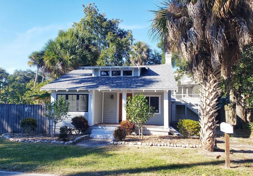 Beautiful classic Florida Cracker style home with a separate building with 2 units.  The 2 buildings are separately metered. This home is move-in ready but has a ton of potential for additional living space. Gorgeous wood floors, fireplace, and open floor plan in the 2BR/1.5BA main house. The garage/apartment area on the first floor of the back building needs work. The upstairs garage apartment, however is ready to rent &  has its own laundry in the bathroom. Both buildings have brand new roofs and the main house has a new central AC. Great location in the heart of town within walking distance to a number of restaurants. ;Water: City