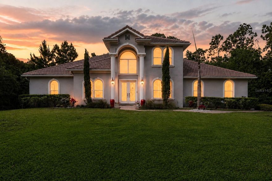One or more photo(s) has been virtually staged. Located in Orlando’s coveted 32836 zip code just moments from the Windermere border, this fully reimagined Cypress Isle residence blends refined design, architectural character, and an exceptional Central Florida lifestyle in one unforgettable setting.
Tucked within a quiet enclave surrounded by the Lake Butler Nature Preserve and the world-renowned Butler Chain of Lakes, this home offers the rare feeling of privacy and serenity while remaining just minutes from Disney, world-class dining, premier shopping, and top-rated schools.
From the moment you step inside, the soaring ceilings and dramatic open foyer create an immediate sense of arrival. Natural light pours through oversized windows, illuminating the home's warm contemporary finishes and thoughtfully designed spaces. The home’s most striking architectural features are the vaulted ceiling and the open upstairs landing and catwalk, overlooking the main living area below — creating a stunning visual connection between both levels and adding a sense of openness rarely found at this price point.
Designed for both elegant entertaining and everyday comfort, the open-concept layout seamlessly flows from formal living and dining spaces into a beautifully appointed chef’s kitchen featuring quartz countertops, custom stainless steel appliances, and an oversized island made for gathering. Luxury vinyl and ceramic tile flooring, oversized doors, and updated double-pane windows elevate the interior with both style and functionality.
The first-floor primary suite is a private retreat, complete with tranquil conservation views, dual vanities, a freestanding soaking tub, and an expansive double shower designed to feel like a luxury spa experience. Upstairs, three additional bedrooms are connected by the dramatic open-air landing that gives the home its signature character and architectural appeal.
Sliding glass doors lead to a covered lanai and screened pool overlooking lush conservation, offering peaceful mornings, sunset evenings, and year-round indoor-outdoor living.
Major 2024 upgrades include new AC, water heater, pool and spa heater, water softener, irrigation system, and gas connection — providing peace of mind and modern efficiency for years to come.
Set among custom estates and natural beauty in one of Central Florida’s most sought-after locations, this is more than a home — it’s a lifestyle defined by space, privacy, connection, and timeless design.