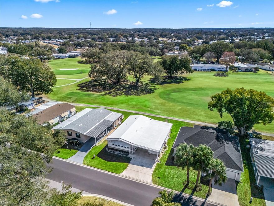 2BR/2BA home in the heart of The Villages’ Historic District! Ideally located just one block from the Orange Blossom Country Club and adult pool, this home offers convenience and lifestyle in one package.  Inside, you’ll find a spacious living and dining room combination, an updated kitchen, and an enclosed lanai—perfect for additional living space, a home office, or hobby area. The guest room features a hidden Murphy bed for flexible use.  Recent updates include newer windows, a newer HVAC system, oversized gutters, and a rubber roof that has been recently resurfaced and coated. Step outside to a large covered rear patio overlooking the 18th hole of Orange Blossom Country Club—an ideal spot to relax or entertain. Additional features include a single-car carport and an attached storage shed with room for a golf cart.  
Conveniently located near shopping along US-441 and just minutes to Spanish Springs Town Square.  Start living the lifestyle you’ve been dreaming of in The Villages—schedule your private showing today!