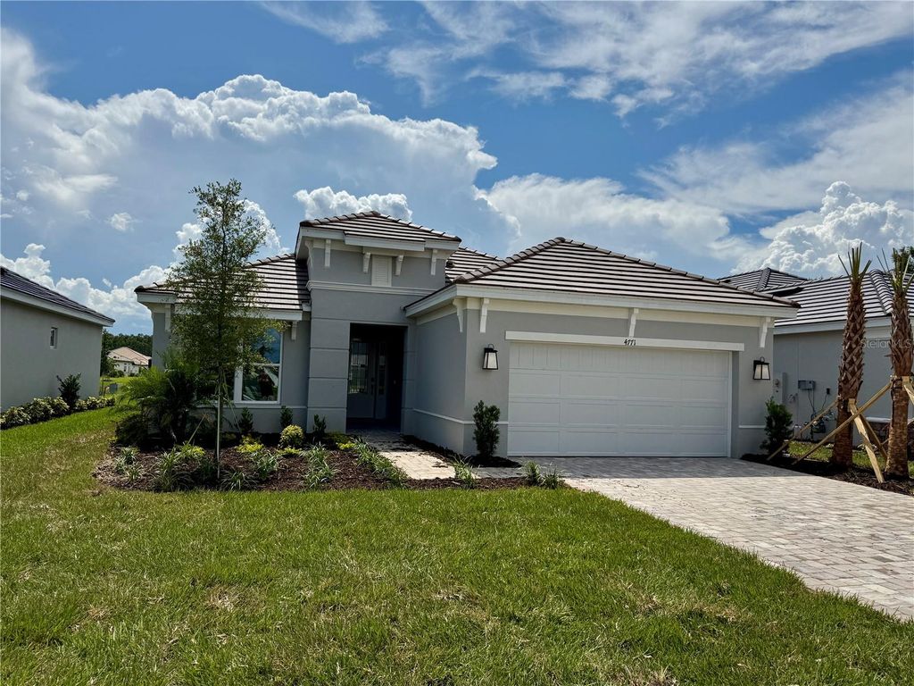 Photo of 4771 Isonzo Way, Wesley Chapel, FL 33543 (MLS # J992065)