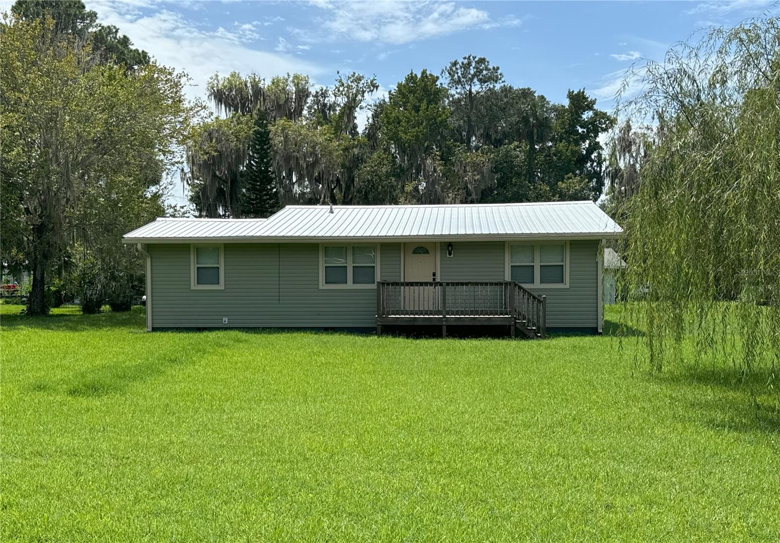 REDUCED! OWNER SAYS SELL! PICTURESQUE REMODELED WATERFRONT BUILT HOME THAT HAS NOT FLOODED! Great investment opportunity if you are looking for a rental to add to your portfolio, great reviews with consistent rental income. Located on the St. John River Canal just feet from the main river. Enjoy fishing in your backyard, gliding in with your boat to the covered boathouse. Quiet with absolutely gorgeous scenery. 3BD/2BTH, Newer metal roof, new hot water heater, AC just serviced, new mini spit with expansive flex room, new electrical on dock, garage and laundry room. New water system. Transferable Termite Bond & Flood Insurance. Ready to move in WITH option on furnishings. Boat to famous Renegades On The River for dinner or the Silver Glen for a swim in the springs, Saint Augustine and other beaches are only an hour away. This home is super cute with lots of storage, workspace and fire pit viewing the canal. Great opportunity for the outdoor enthusiast, don’t miss this one! All information is deemed reliable, but buyers should conduct their own due diligence. See link for interior videos added to YouTube.