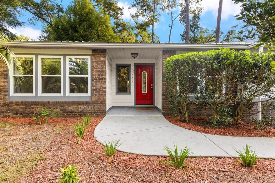 Welcome home to Rock Creek, one of Northwest Gainesville's most beloved neighborhoods! This 4 bedroom, 2 bathroom home has been lovingly maintained and is ready for new owners. You'll appreciate the attractive and durable metal roof (2012), updated thermal efficient windows with a transferable warranty (2020), updated water heater (2021), updated HVAC with 10 yr warranty (2022), updated fencing & gate (2023), all new exterior paint, gutters, washer, dryer, and stove (2025), and so much more! This home is situated on an oversized lot (0.41 acre) and located at the back of the south loop making it extra quiet. When you arrive you'll enjoy the mature landscaping, updated exterior, and side entry garage with plenty of parking space for family and friends. Step inside to beautiful maple hardwood floors, cedar wood details, a brick fireplace, and two large living spaces. The dining room, kitchen, and breakfast nook flow seamlessly. The primary suite is spacious and well lit with a peaceful view of the backyard. Three guest bedrooms and a full guest bathroom complete the interior of the home. There's so much to love about this home and neighborhood: Rock Creek is conveniently located off NW 34th Street where Possum Creek and Three Lakes Creek converge. It's a beautiful canopied sanctuary right in the heart of Gainesville with miles of paved road so you can walk, run, or bike without ever leaving the neighborhood. Neighborhood amenities include a well-shaded playground and community pool & tennis courts creating a family-friendly environment. Come fall in love today!