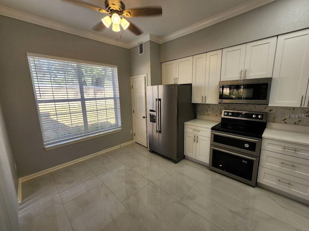 Photo of 7511 Bay Port Rd #5, Orlando, FL 32819 (MLS # G5110629)