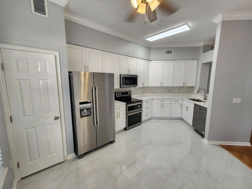 Photo of 7511 Bay Port Rd #5, Orlando, FL 32819 (MLS # G5110629)