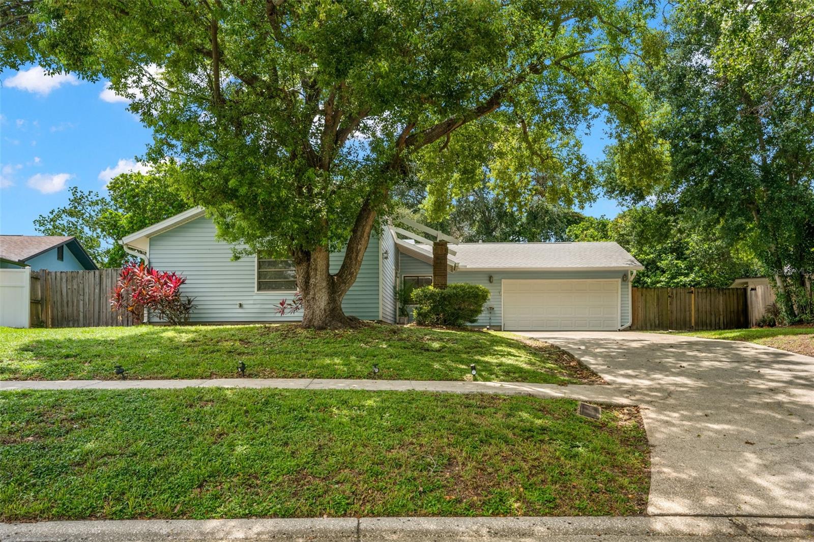 Under contract-accepting backup offers. LOCATION, LOCATION! This four-bedroom, two-bath single-family home offers a flexible layout, private outdoor oasis, and a prime Clearwater location! Upon entering through the covered front entry, you're greeted by a foyer that opens to your formal living room and dining area. The living room features tile flooring and soaring vaulted ceilings, creating a sense of openness and airiness. Adjacent to the living space, the formal dining area boasts warm wood flooring, ideal for hosting intimate dinners or large gatherings. Located privately at the front of the home the primary en suite includes an updated dual-sink vanity, step-in shower, ample space for additional furniture or sitting area. This retreat is thoughtfully separated from the secondary bedrooms for peace and quiet. The heart of the home is the open-concept kitchen, which showcases rich dark wood cabinetry, granite countertops, stainless steel appliances, a breakfast bar seating for casual dining and a breakfast nook. The kitchen flows effortlessly into the family room, which features a cozy wood-burning fireplace, creating a perfect setting for both everyday living and entertaining. Connected to the family room is a bonus room that serves as an ideal home office, playroom, or potential guest space. French doors lead directly out to your covered lanai, extending your living space outdoors. Step outside to your lanai, perfect for al fresco dining or relaxing in the shade. Beyond, enjoy your inground pool and spa. This backyard oasis is fully fenced for privacy and includes an expansive side yard with a concrete patio, perfect for a fire pit or additional seating area. Back inside, there are three additional bedrooms at the rear of the home, each with large wall closets, ample natural light from oversized windows, while the 4th bedroom includes private French door access to the backyard. The shared hall bath features a tub/shower combo and there is a linen closet as well. Additional functional features include a laundry room with upper cabinets and an additional storage closet, large kitchen pantry with built-in shelving, plus direct access to the two-car garage from kitchen. This home offers flexible living, thoughtful updates, and a layout perfect for both relaxing and entertaining. Enjoy the Florida lifestyle just minutes from waterfront parks, local restaurants, and shops! Don’t miss this opportunity—schedule your private showing today!