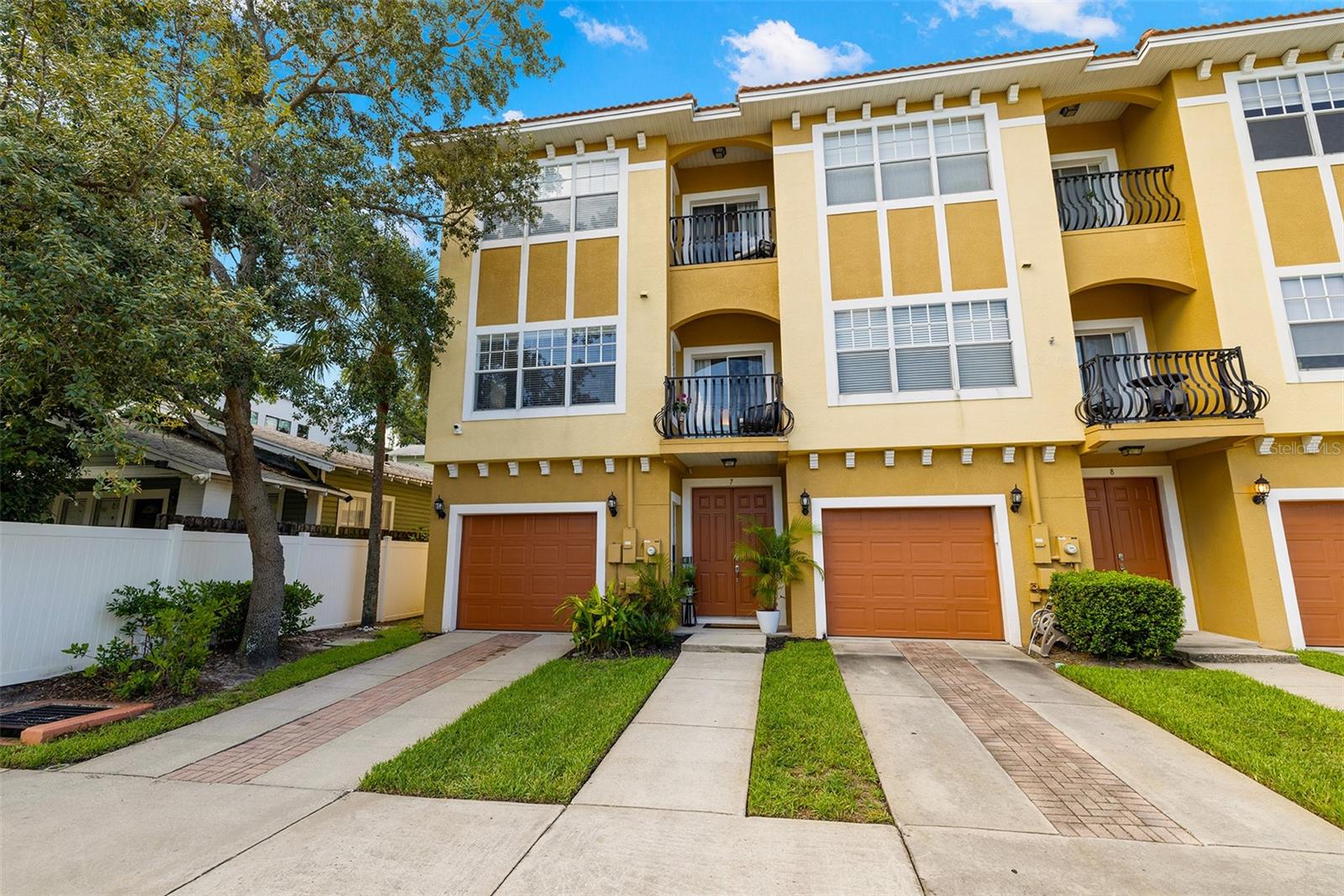 LOCATION!!! UPDATED CORNER UNIT NORTH HYDE PARK TOWNHOME near downtown Tampa and convenient to Tampa
International Airport, Riverwalk and Armature Works. Enjoy close proximity to dazzling, trendy downtown Tampa while enjoying home life in a residential neighborhood close by. This 3-bedroom, 3.5-bath home features a modern interior with gorgeous luxury vinyl flooring and stainless
steel appliances. The ground floor consists of a 2-car tandem garage and a guest bedroom that would also make an ideal office
space, with its own bath nearby. The second floor offers an open-concept layout, combining the kitchen, dining, and living areas
with a balcony for quiet time with a morning cup of coffee or an adult beverage at the end of a busy day. This large open space with high ceilings makes a very attractive area for relaxing or entertaining. A half bath is available on this floor as well as a laundry room just off the kitchen. The third floor features a spacious primary suite with a walk-in closet, dual-sink bath, tub, and private balcony. The other bedroom
on this floor also has a walk-in closet and its own bathroom. The sale includes a Vivint security system with 4 cameras, providing
added value. The location in Flood Zone X adds to the affordability of this well-priced property. Schedule your private showing today!