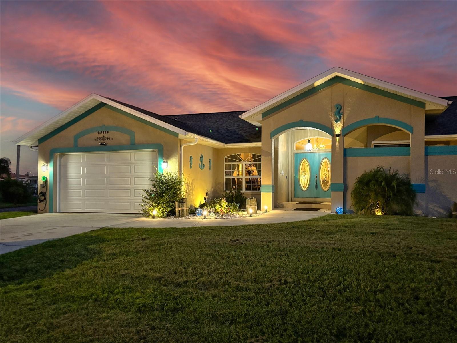 AMAZING 3 BEDROOM, 2.5 BATH, 2-CAR GARAGE WATERFRONT POOL HOME WITH BOATING ACCESS UNDER A MINUTE TO JIM LONG LAKE WHICH LEADS TO CHARLOTTE HARBOR AND THE GULF! COMPLETE WITH TWO BOAT LIFTS AND JET SKI LIFT, WATER AND ELECTRICITY. Split floorplan with double door entry, ample natural light, high ceilings and luxury vinyl throughout. Step inside to the formal living and dining room with slider overlooking pool and water views. The kitchen offers wood cabinetry, quartz countertops, stainless steel appliances, closet pantry, breakfast bar and eat-in kitchen perfect for entertaining. Generous primary bedroom has slider access to lanai and pool, high ceilings, two walk-in closets, and additional water views. Private ensuite bath features dual sinks, soaker tub, walk-in shower, and ensuite private patio. The split bedroom layout boasts two inviting guest rooms that share a guest bath. Outdoor living is a highlight here, with a covered lanai and heated pool with table built in for entertainment. Enjoy the convenience of an outdoor half bath and shower. From the lanai, head down to the separate patio area near boathouse workshop and jet ski and boat lift complete with water, electric, and breathtaking water views—perfect for fishing or simply soaking in the beautiful surroundings. Additional features include plantation shutters throughout the house and blinds, water softener, reverse osmosis system, irrigation system, ManaBloc Manifold plumbing in laundry room and built-in fold away ironing board, washer & dryer 1 year old, 9000 watt portable generator with whole house hookup, hurricane rated sky lights, impact garage doors and pull down hurricane shutters recently added, whole house Bluetooth audio system, 20x12 shed with electric for additional storage, putting green and fenced in shaded exterior dog run with artificial turf, electric and water. Quiet and peaceful neighborhood located close to US-17, and just a short drive to restaurants, shopping, schools, parks, golf and 15-minutes from downtown historic Punta Gorda, known for its world-class fishing and boating, community events and entertainment. Don’t miss this opportunity! Schedule your private showing today!