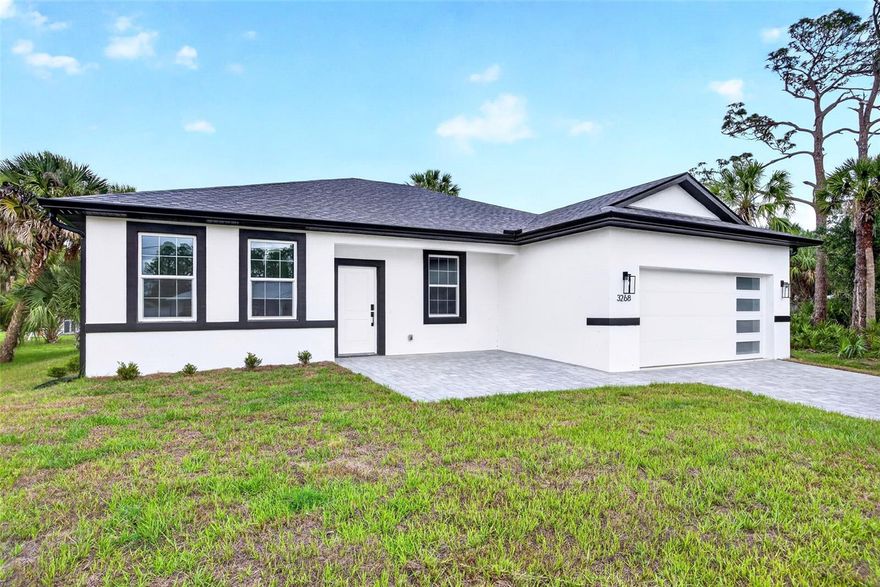 JUST COMPLETED! BRAND NEW 4 BEDROOM, 3 BATH, 2-CAR GARAGE HOME IN NORTH PORT! Stunning new construction home, designed with thoughtful details for comfort and style. Open floor plan with high ceilings, luxury vinyl flooring, contemporary and recessed lighting plus much more. Well-appointed kitchen offers soft-close cabinetry, quartz waterfall countertops, tile backsplash, stainless steel appliances, closet pantry and center island overlooking the dining and living areas. Generous primary bedroom with his and her walk-in closets and en-suite bath featuring dual sinks, LED mirror, and walk-in tile shower. Split floor plan provides guests with plenty of privacy, featuring 3 additional bedrooms, a full guest bath, and one bedroom with its own ensuite bath perfect for hosting guests or family. Outdoor entertaining area features covered lanai and plenty of room for a pool in the backyard. Additional highlights include impact windows and doors, smart thermostat, water filtration system, epoxy garage flooring, and paver driveway. Nestled on a quiet street you'll enjoy the peace of suburban living while still being just minutes away from shopping, dining, and everyday conveniences with easy access to I-75. With North Port's affordability, friendly atmosphere, and strong community feel it's easy to see why so many are choosing to call this area home. Don’t miss this opportunity! Schedule your private showing today!