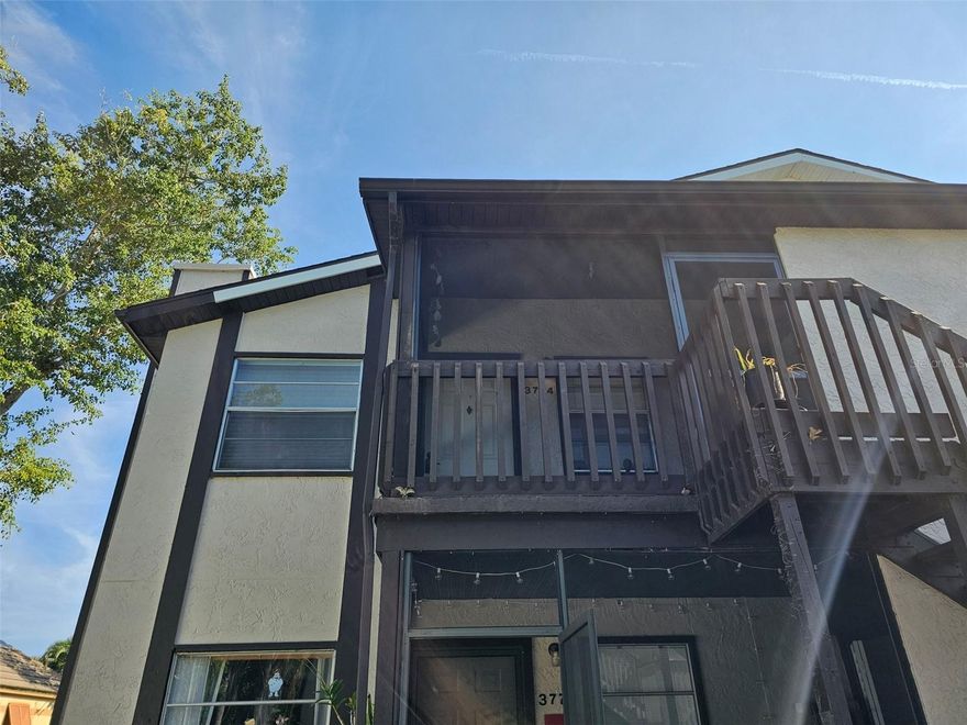 Tucked away on the second floor, this inviting two-bedroom, two-bath residence offers a warm and comfortable retreat with a peaceful garden view. Wood laminate flooring flows throughout the living spaces, complemented by tile in the kitchen, baths and screened patio, creating a clean and cohesive feel. The open living and dining area is perfect for relaxing or entertaining, highlighted by a charming wood-burning fireplace that adds character and warmth. Just beyond, a convenient breakfast bar opens to the galley-style kitchen, equipped with a range, refrigerator, and dishwasher—everything you need for easy everyday living. The primary bedroom features a generous walk-in closet and a private bath with a walk-in shower, while the guest bedroom is nicely situated near the second full bath with a tub/shower combination. A washer and dryer are tucked into a closet on the front screened patio, offering both convenience and extra outdoor space to enjoy the Florida breeze.
Residents enjoy access to a heated community pool, small exercise room, sauna, and tennis courts. Ideally located near IMG Sports Academy, the State College of Florida, shopping, and a variety of restaurants, this home also places you just a short drive from some of the area’s most beautiful beaches—perfect for enjoying the best of the Florida lifestyle.