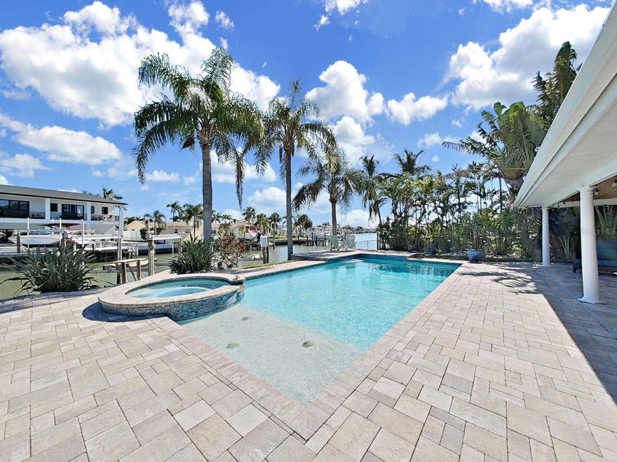 **HUGE Price Reduction!** Welcome to your waterfront dream retreat in the highly desirable community of Oakhurst Shores in Seminole! This newly renovated coastal residence offers the perfect combination of luxury, style, and Florida outdoor living with direct water access and two boat lifts (13k and 7k). Featuring 3 spacious bedrooms, 2 modern bathrooms, and 2 car garage, this home has been thoughtfully updated throughout. The brand-new designer kitchen showcases sleek cabinetry, quartz countertops, stainless steel appliances including a gas stove, and a large island, perfect for entertaining. Step outside to your backyard oasis, where you’ll enjoy a large sparkling pool with gas heated spillover spa, expansive paver deck, and covered lanai—ideal for year-round relaxation. Boaters will appreciate the private dock with TWO lifts, offering quick access to the Intracoastal Waterway and Gulf of Mexico. Located just minutes from Gulf beaches, Seminole City Center, dining, parks, and top-rated schools, this move-in ready home is perfect for those seeking the waterfront Florida lifestyle without compromise. Additional features include - Natural Gas Tankless Water Heater,  Main roof - 2018, Flat Roof - 2016, Pool resurfaced - 2012, Boat Lifts installed - 2012, HVAC - 2017. House recently appraised at list price.
